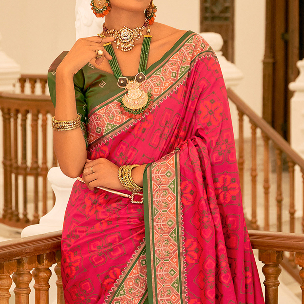 Rani Pink Patola Printed Banarasi Silk Saree With Tassels