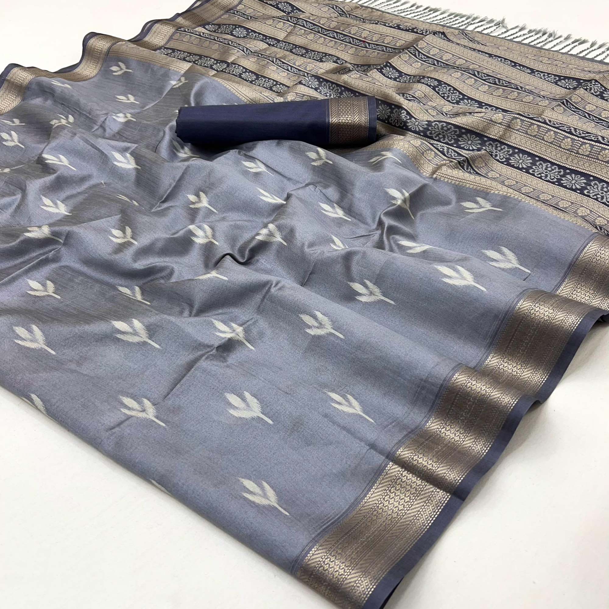 Grey Ikkat Style Rayon Silk Saree with Luxurious Zari Border and Delicate Tassels