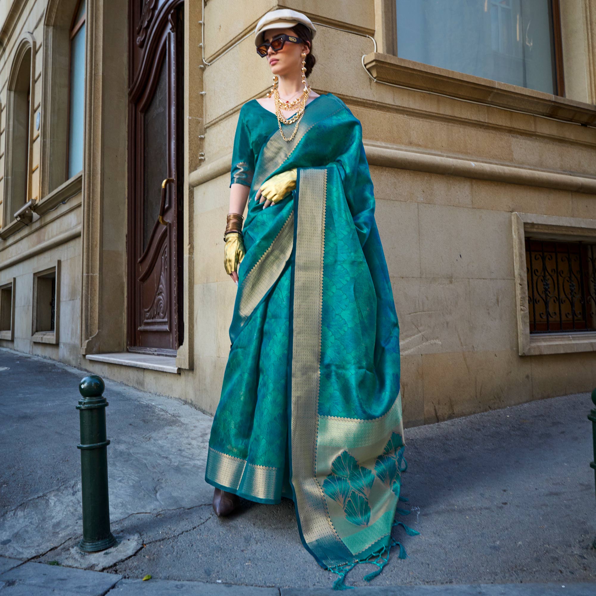 Teal Zari Woven Organza Saree Tassels