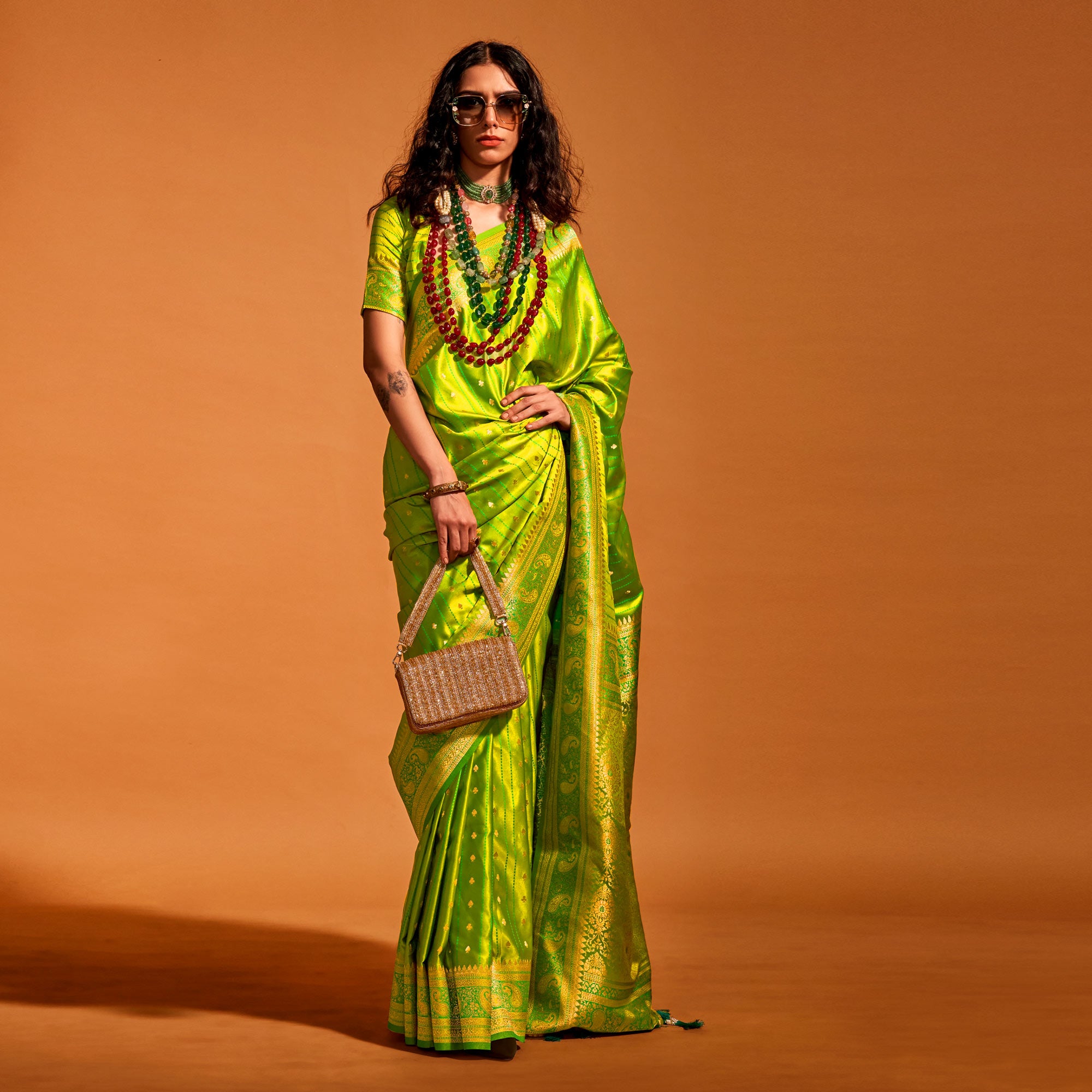 Green Woven Zari Border Satin Saree With Tassels