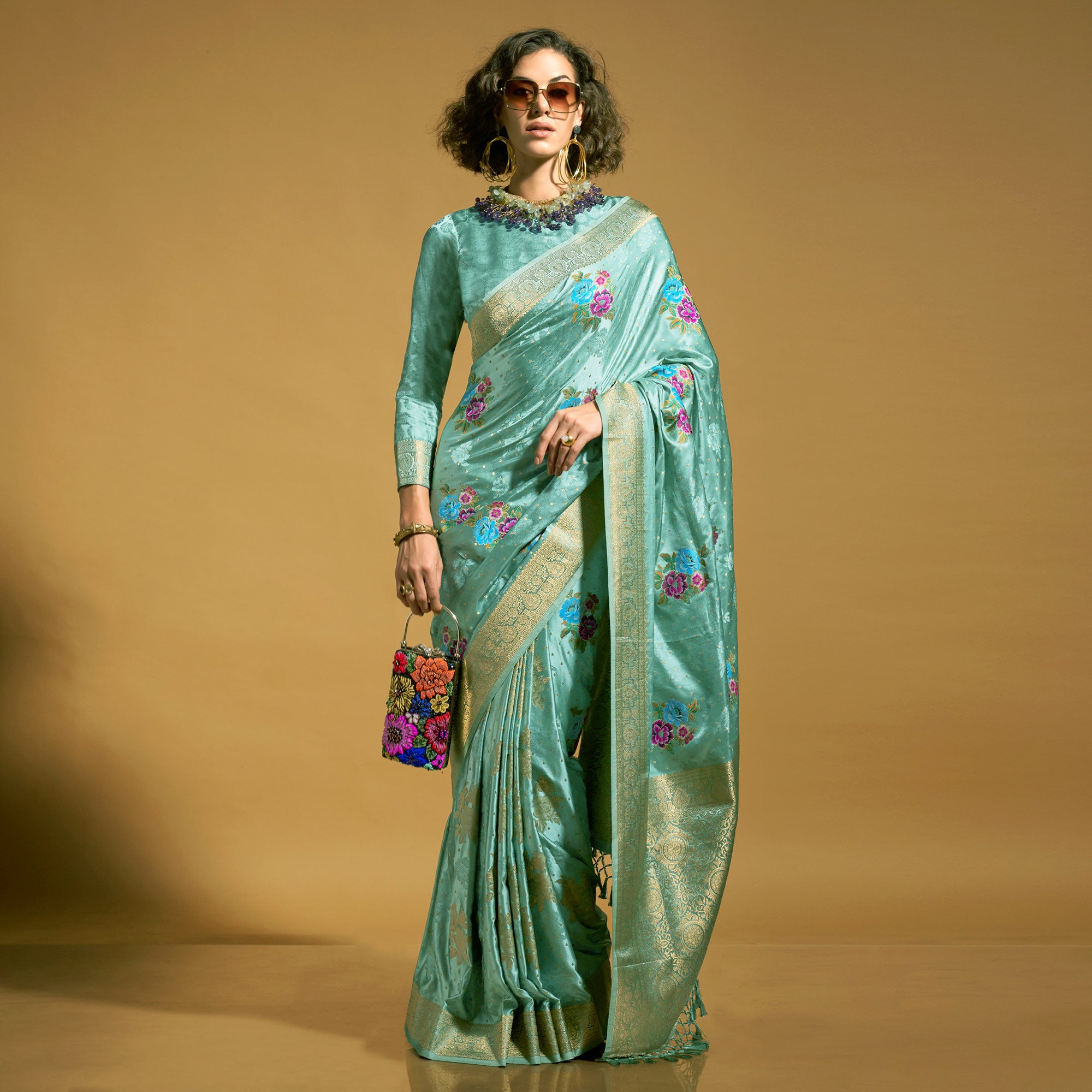 Light Turquoise Floral Woven Satin Saree With Tassels