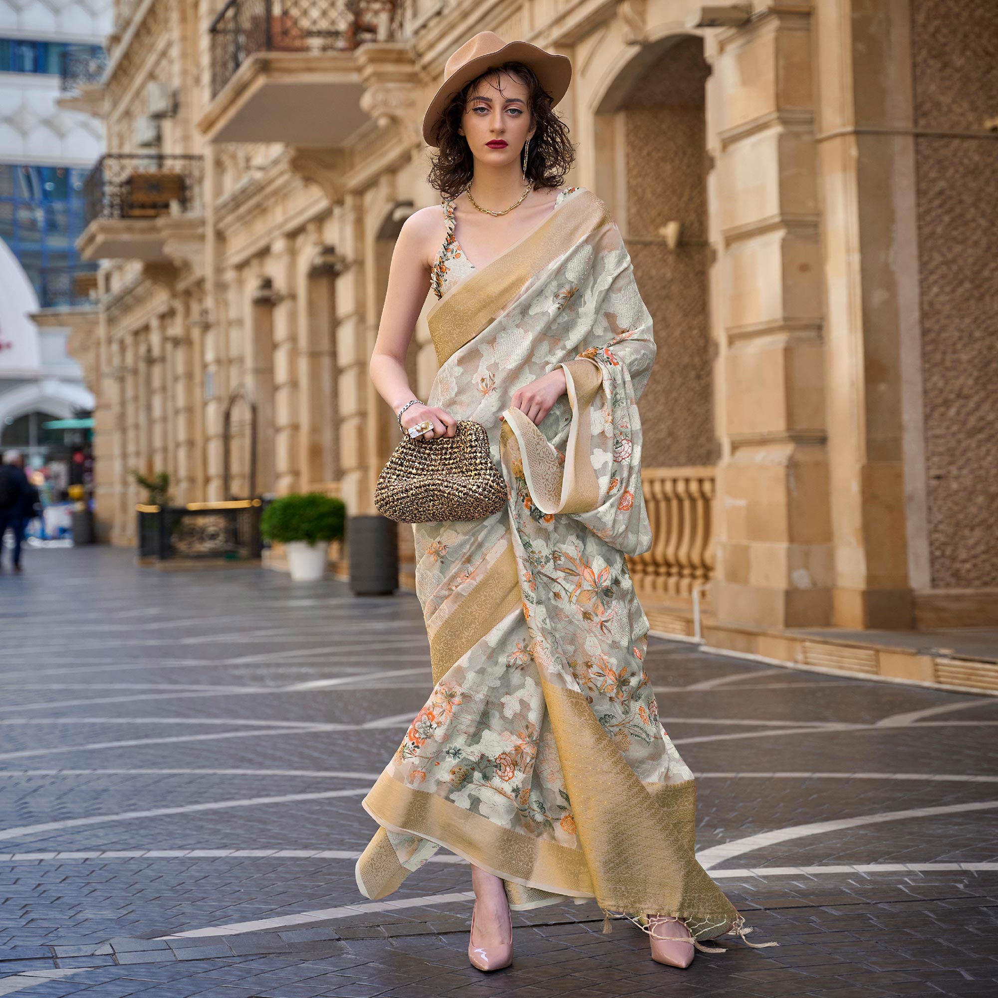 Beige Floral Woven Brasso Saree With Tassels
