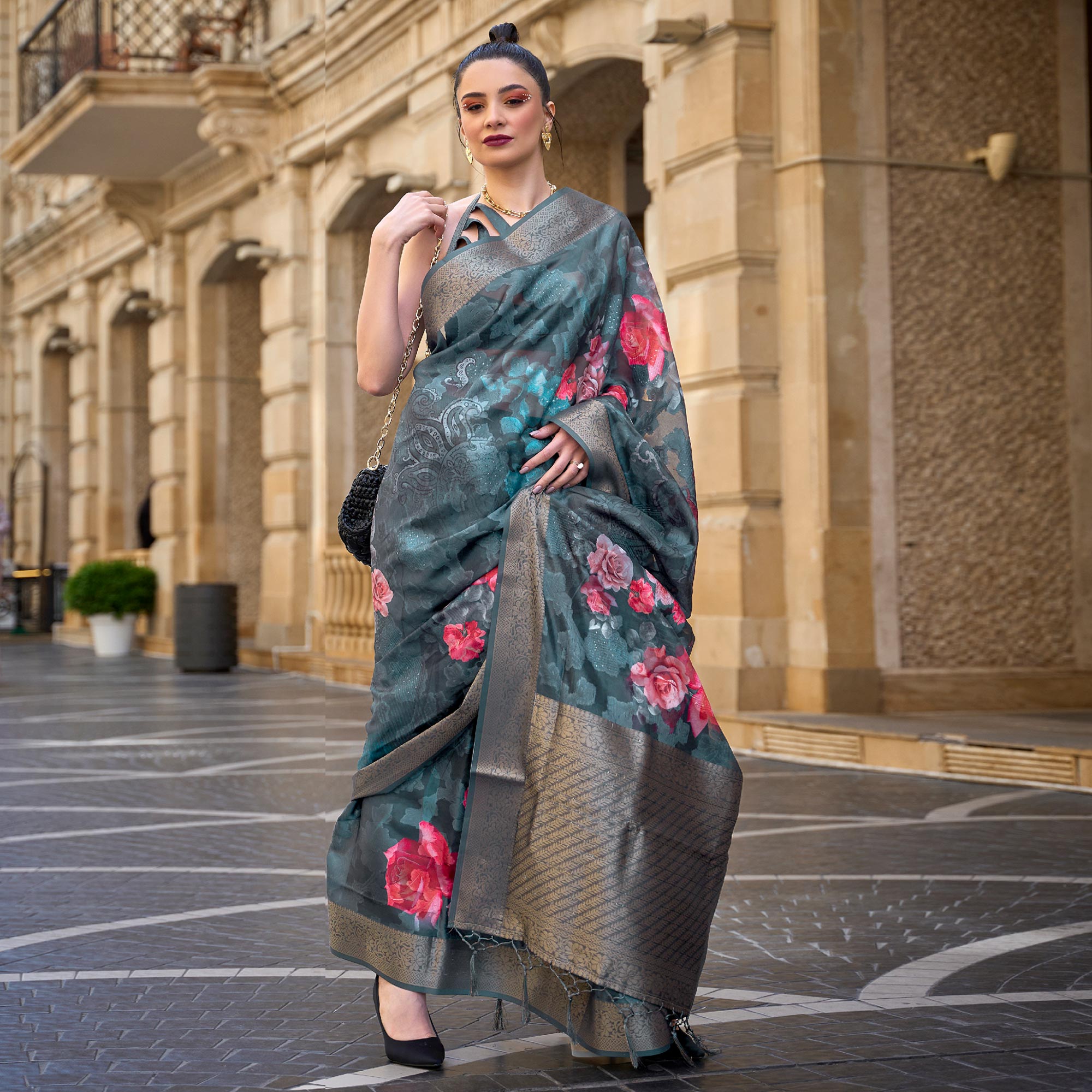 Teal Floral Woven Brasso Saree With Tassels