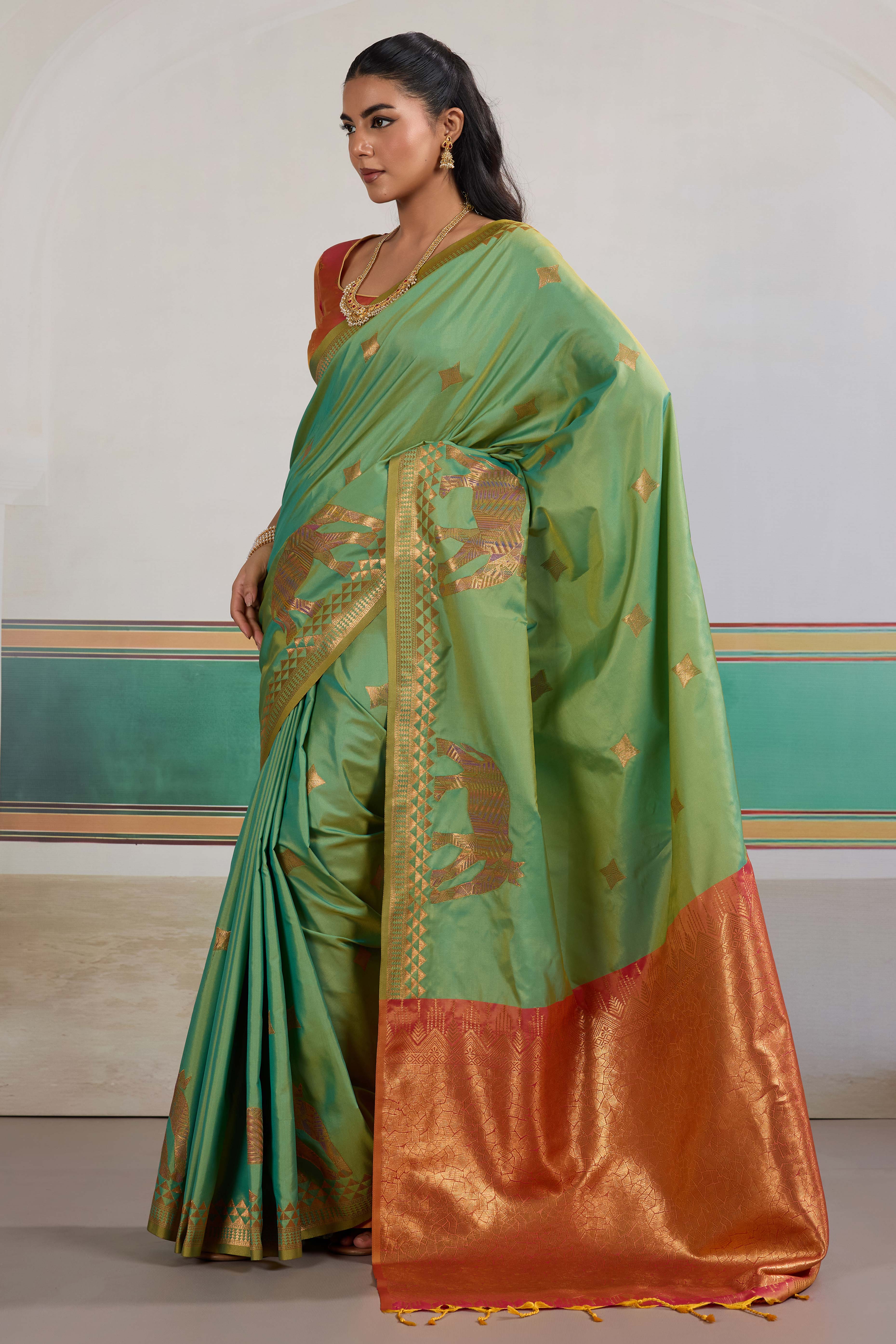 Traditional Green Pure Silk Saree Featuring Elephant Motif Zari Weaving & Tassel Pallu