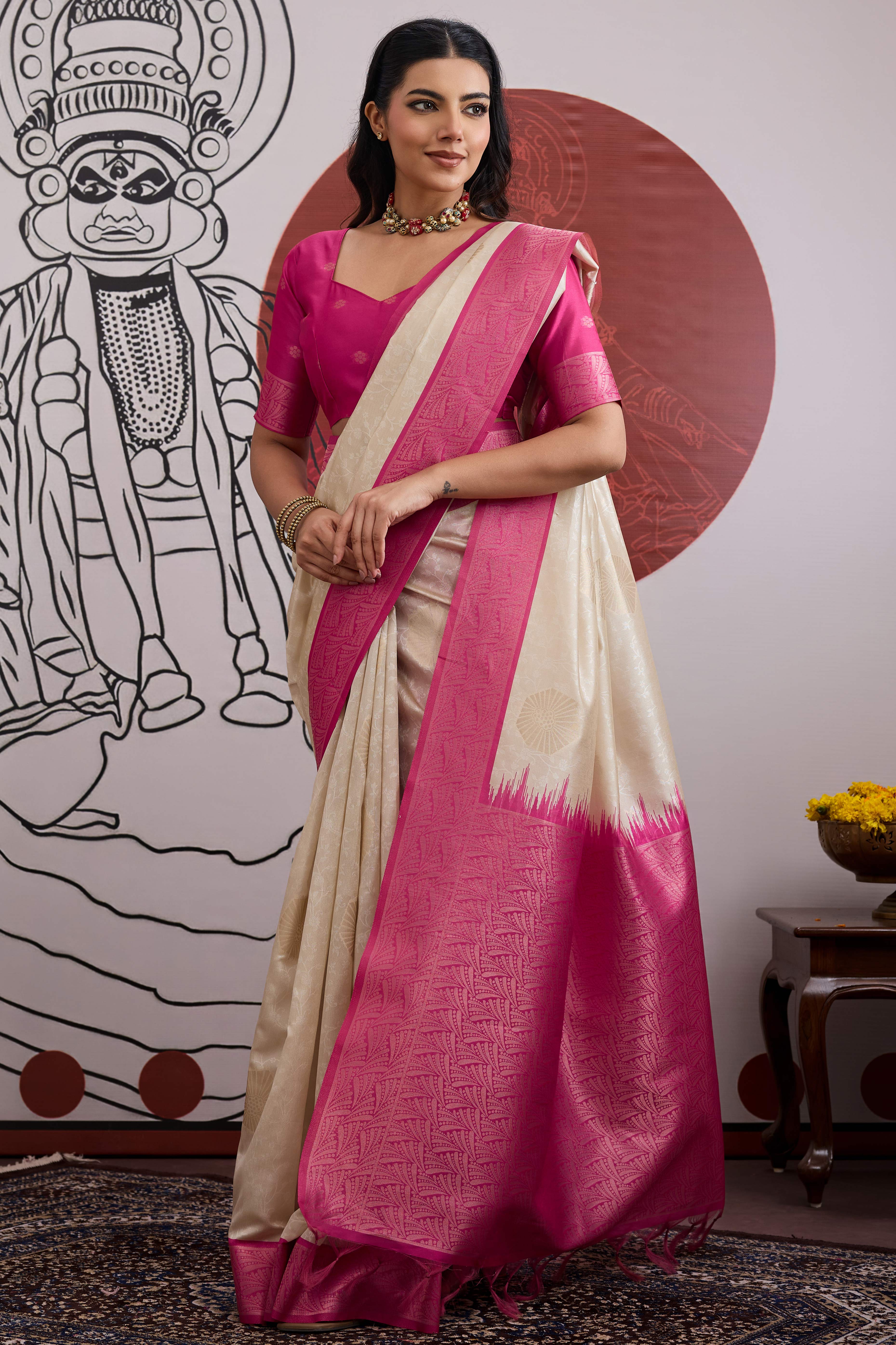 Graceful Cream & Pink Zari Weaving Silk Saree Highlighted By Decorative Tassel Pallu