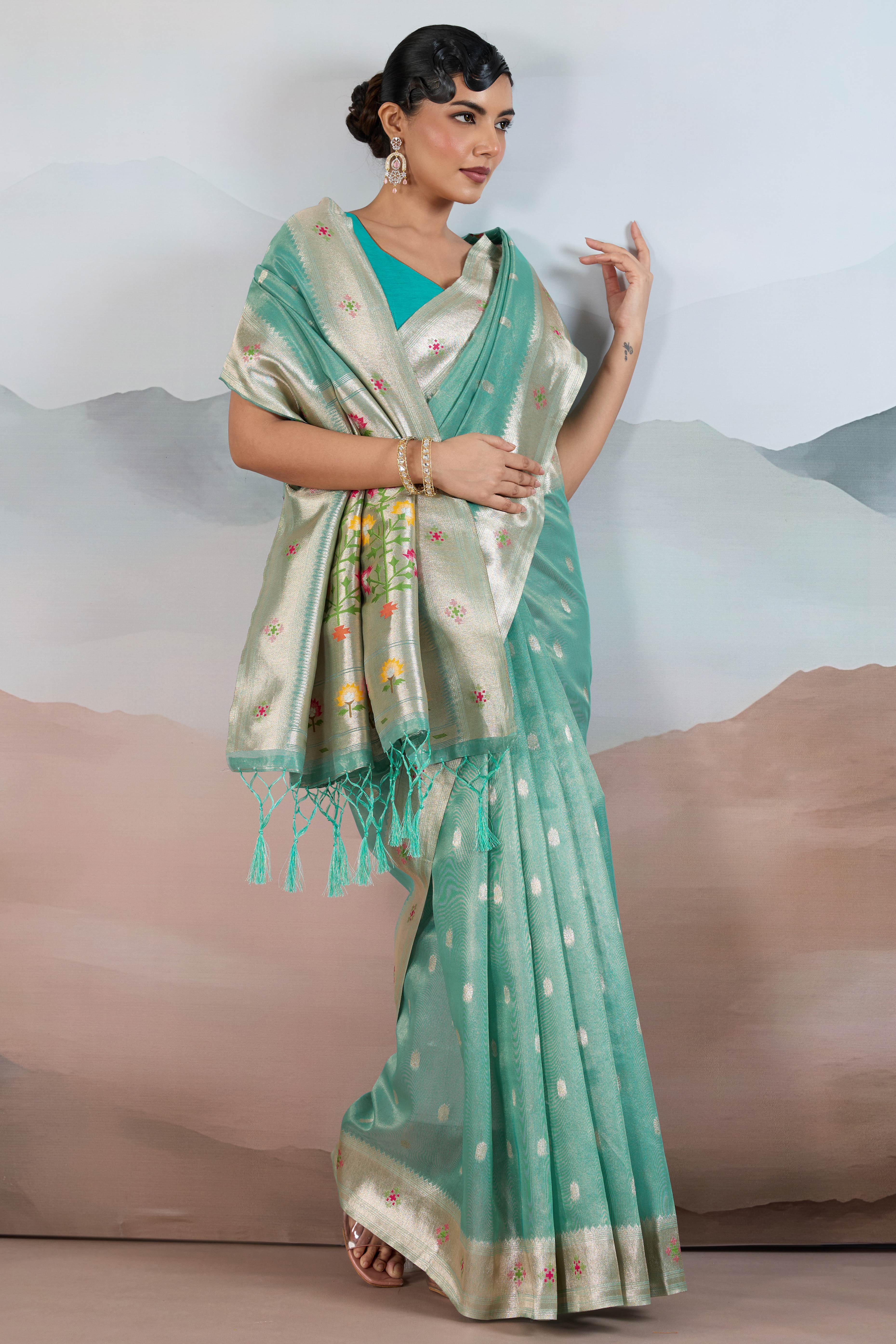 Turquoise Festive Tissue Saree Crafted with Artistic Zari Butti Weaving and a Featherlight Texture