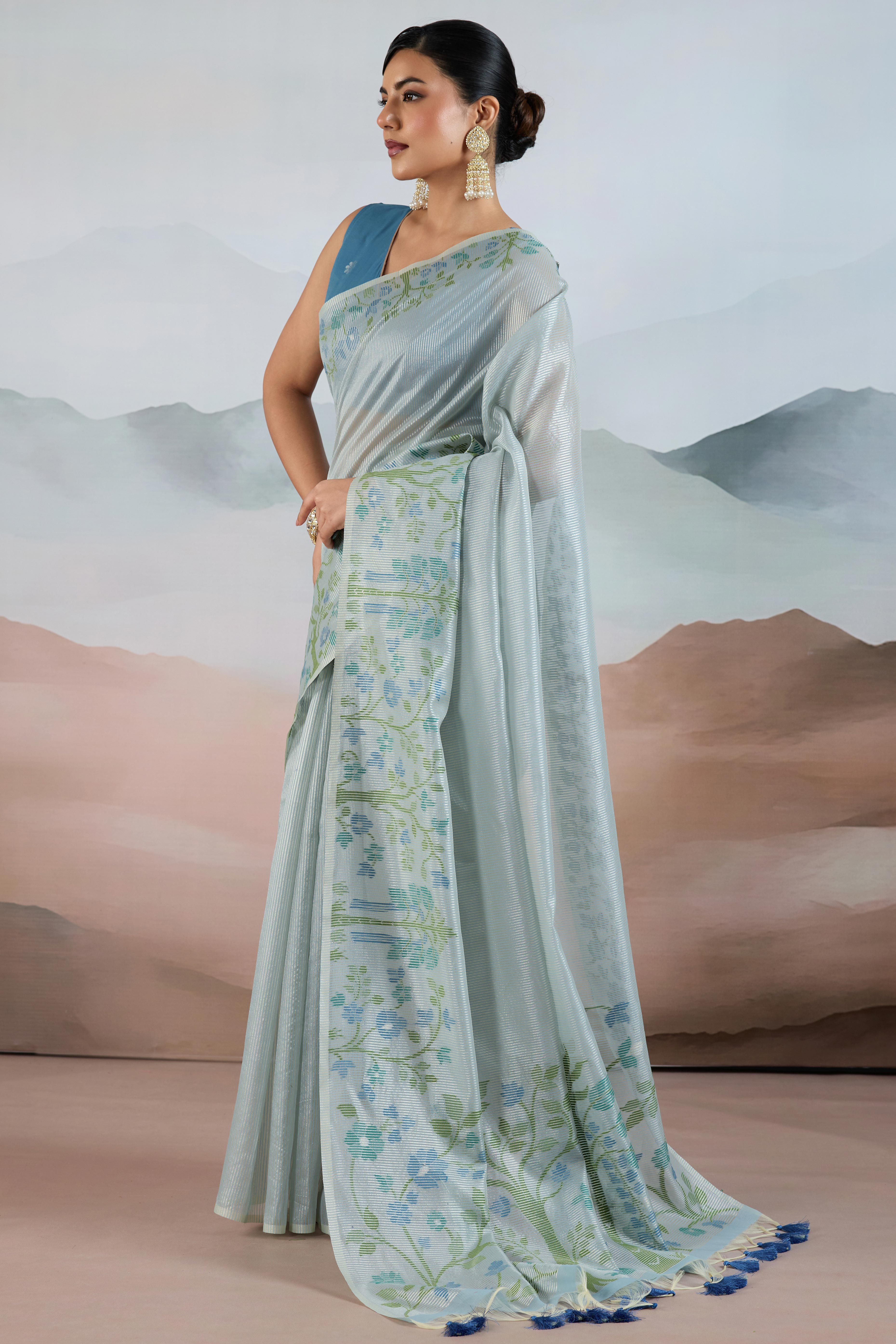 Blue Tissue Silk Saree Showcasing Floral & Striped Weaving With Tassel Adornment
