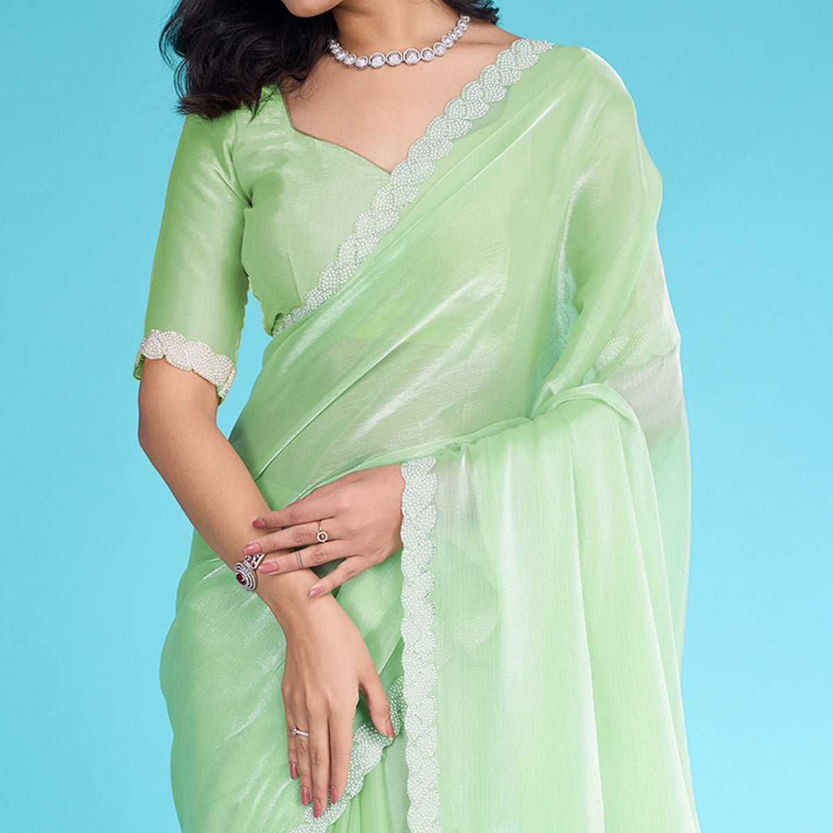 Green Solid With Zarkan & Ceramic Pearl Diamond Lace Tissue Saree