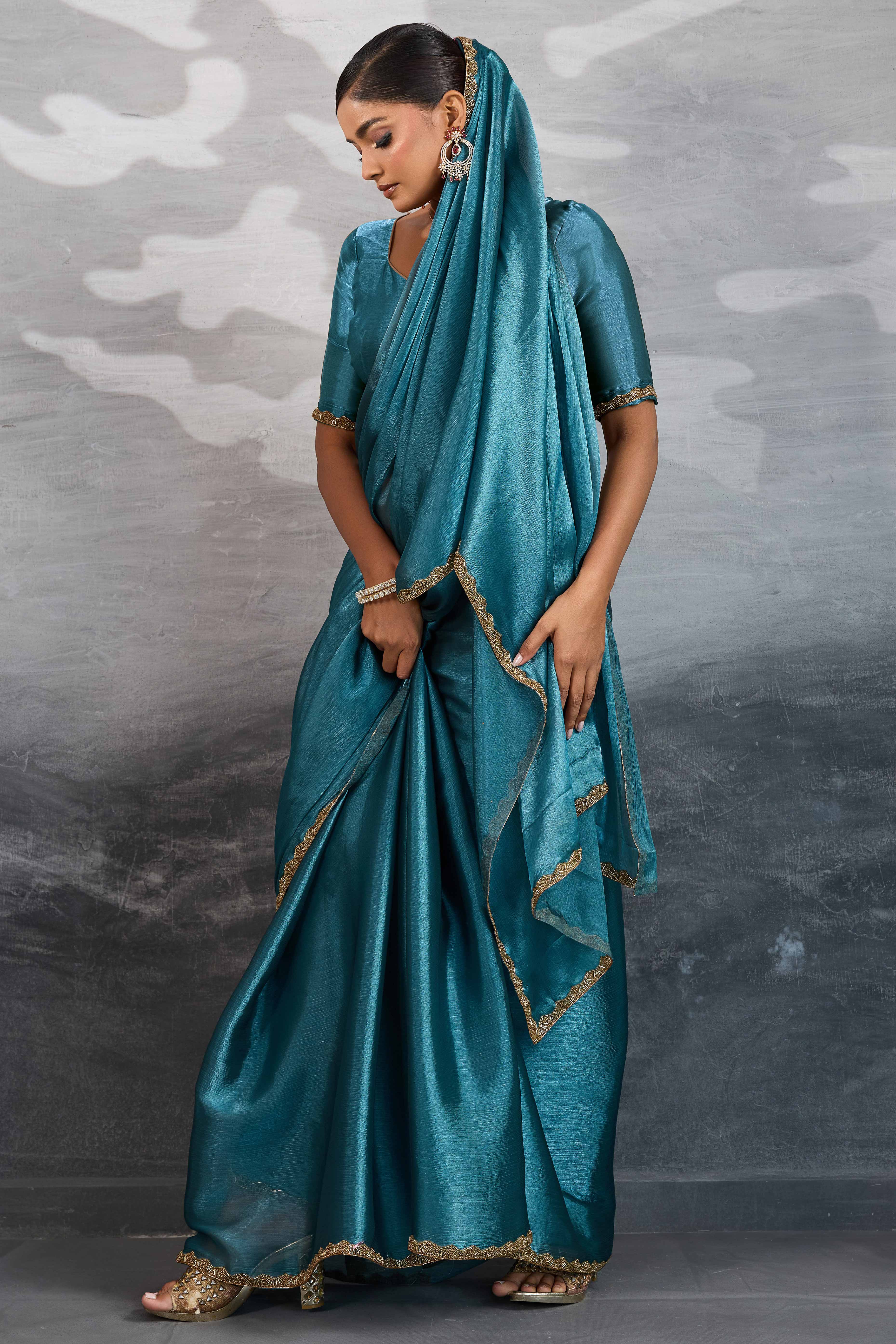 Solid Teal Chiffon Saree Featuring Beads Embellished Border