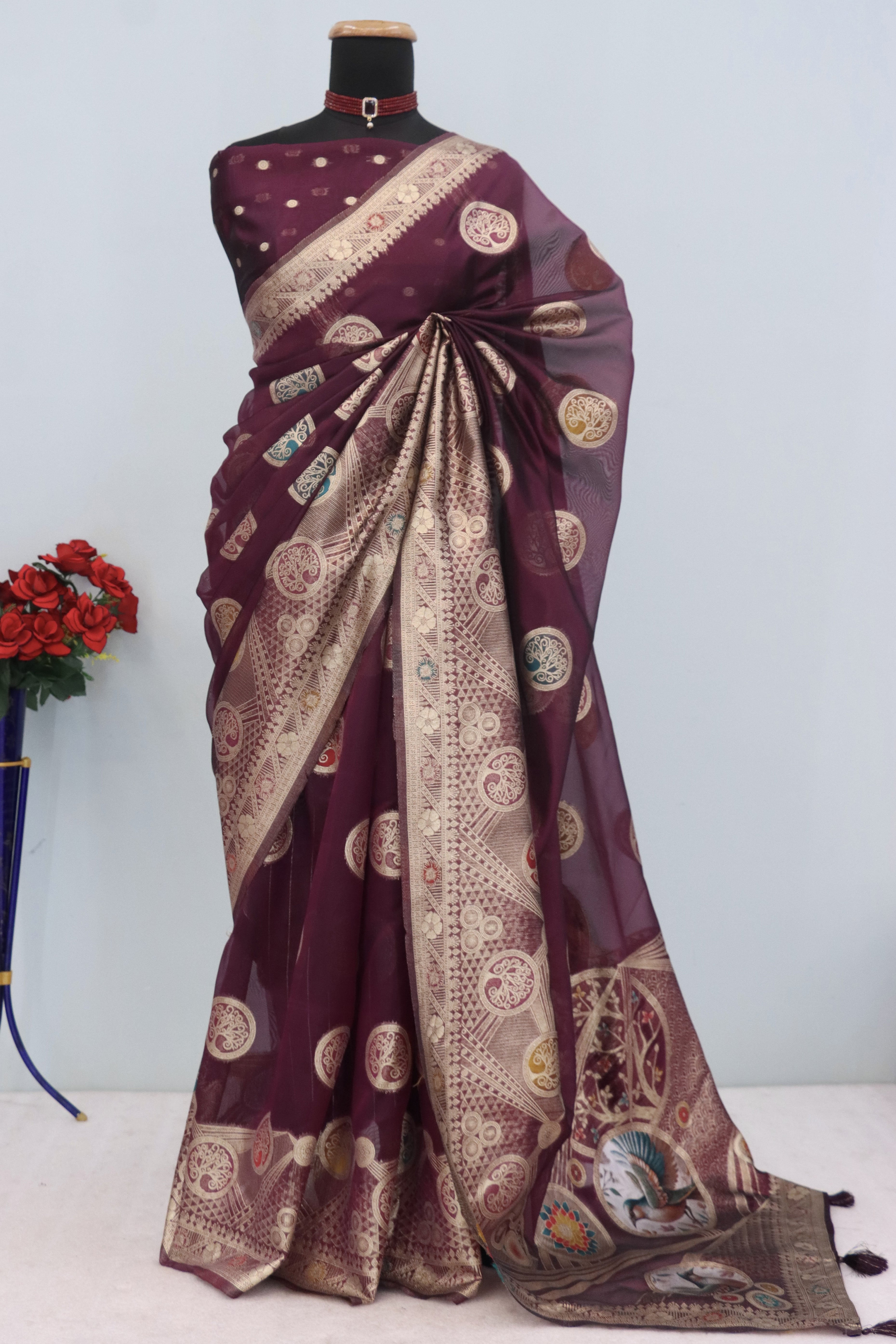 Charming Wine Zari Woven Floral Organza Saree Accented With Digital Printed Pallu & Latkan