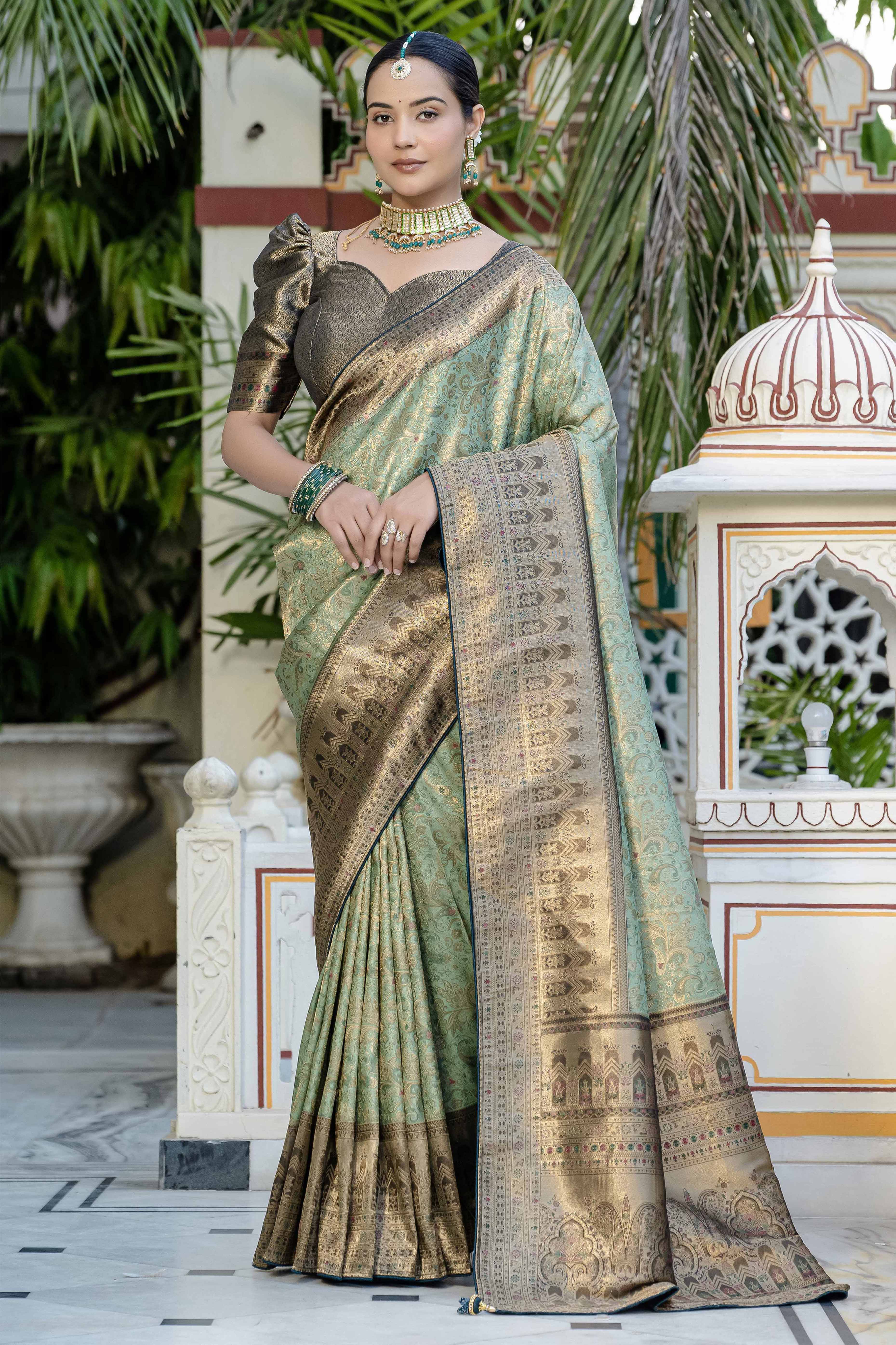 Green Kanjivaram Silk Saree Showcasing Floral Meenakari Zari Weaving With Elegant Piping & Tassels