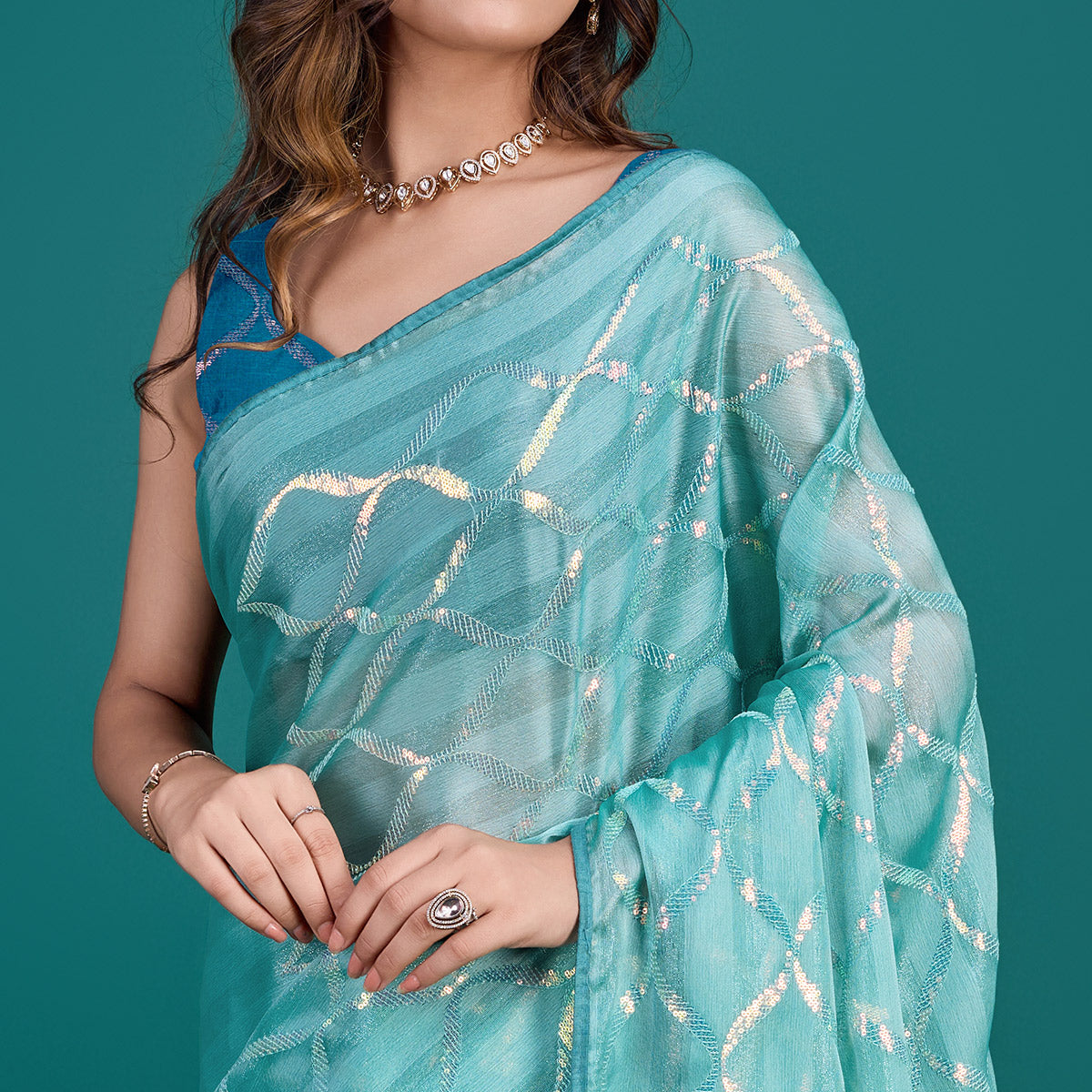 Turquoise Sequins Embroidered Georgette Saree