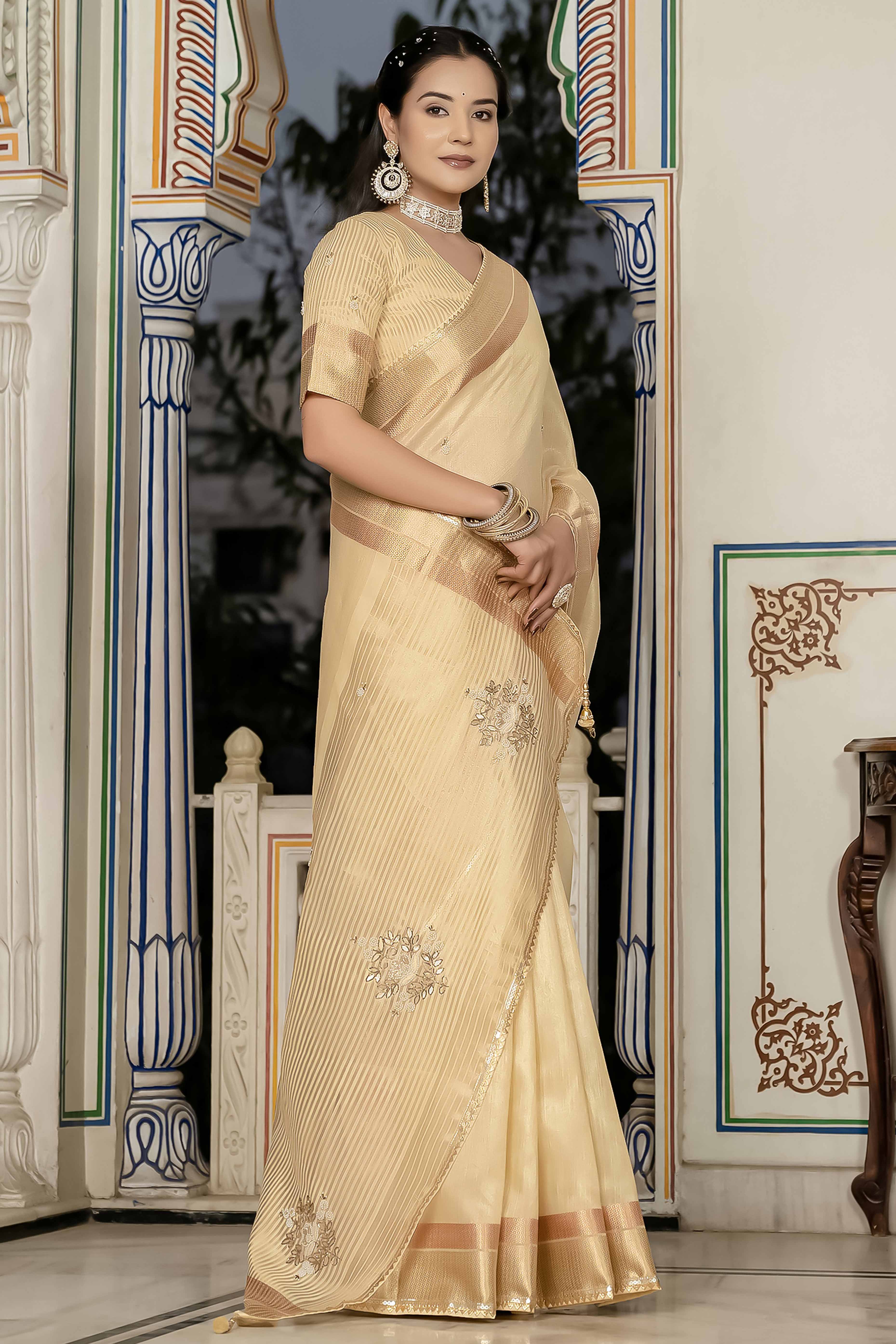Beige Tissue Linen Saree Featuring Intricate Zari and Beadwork