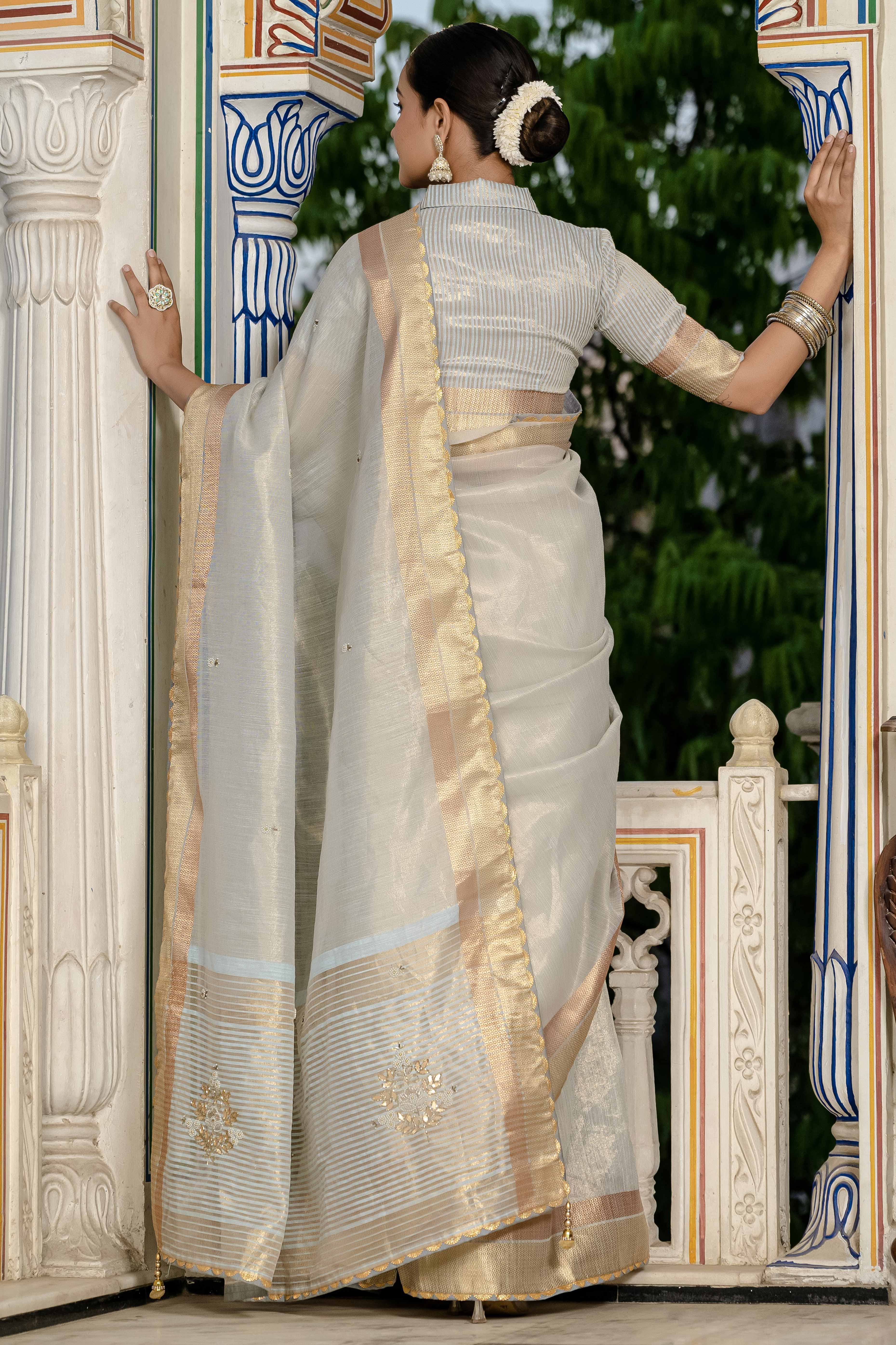 Sky Blue Tissue Linen Saree Featuring Intricate Zari and Beadwork
