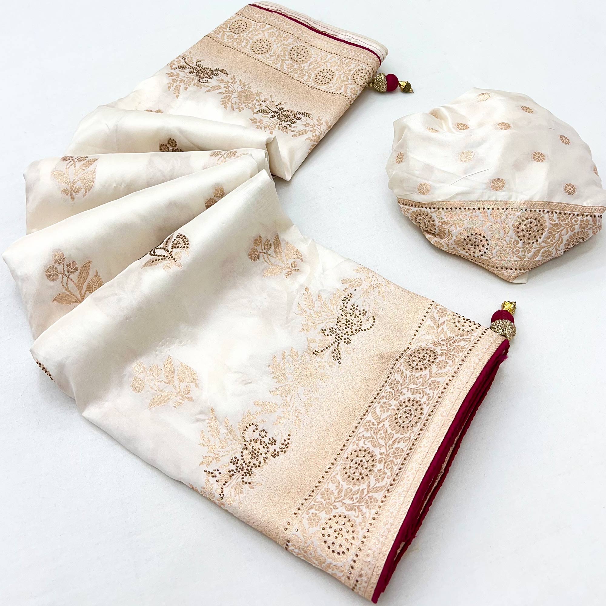 Offwhite Elegant White Dola Silk Saree with Intricate Weaving and Sparkling Stonework