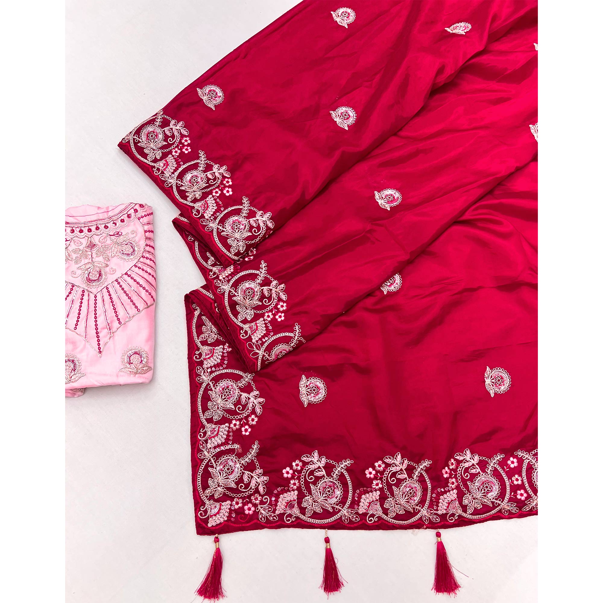Rani Pink Embroidered Satin Saree with Smooth Texture and Graceful Festive Appeal