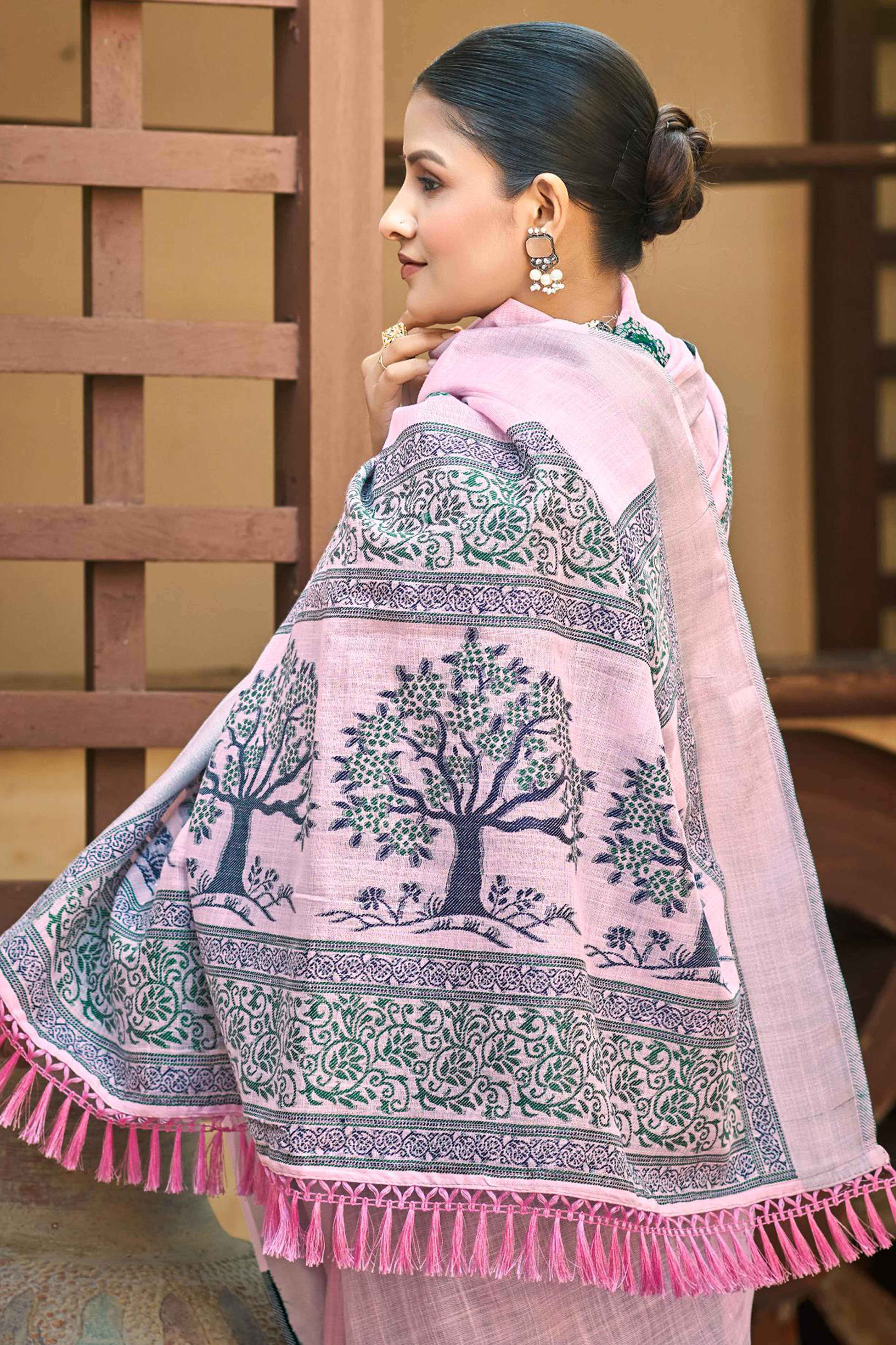 Light Pink Linen Saree Adorned With Intricate Zari Weaving & Tassel Pallu