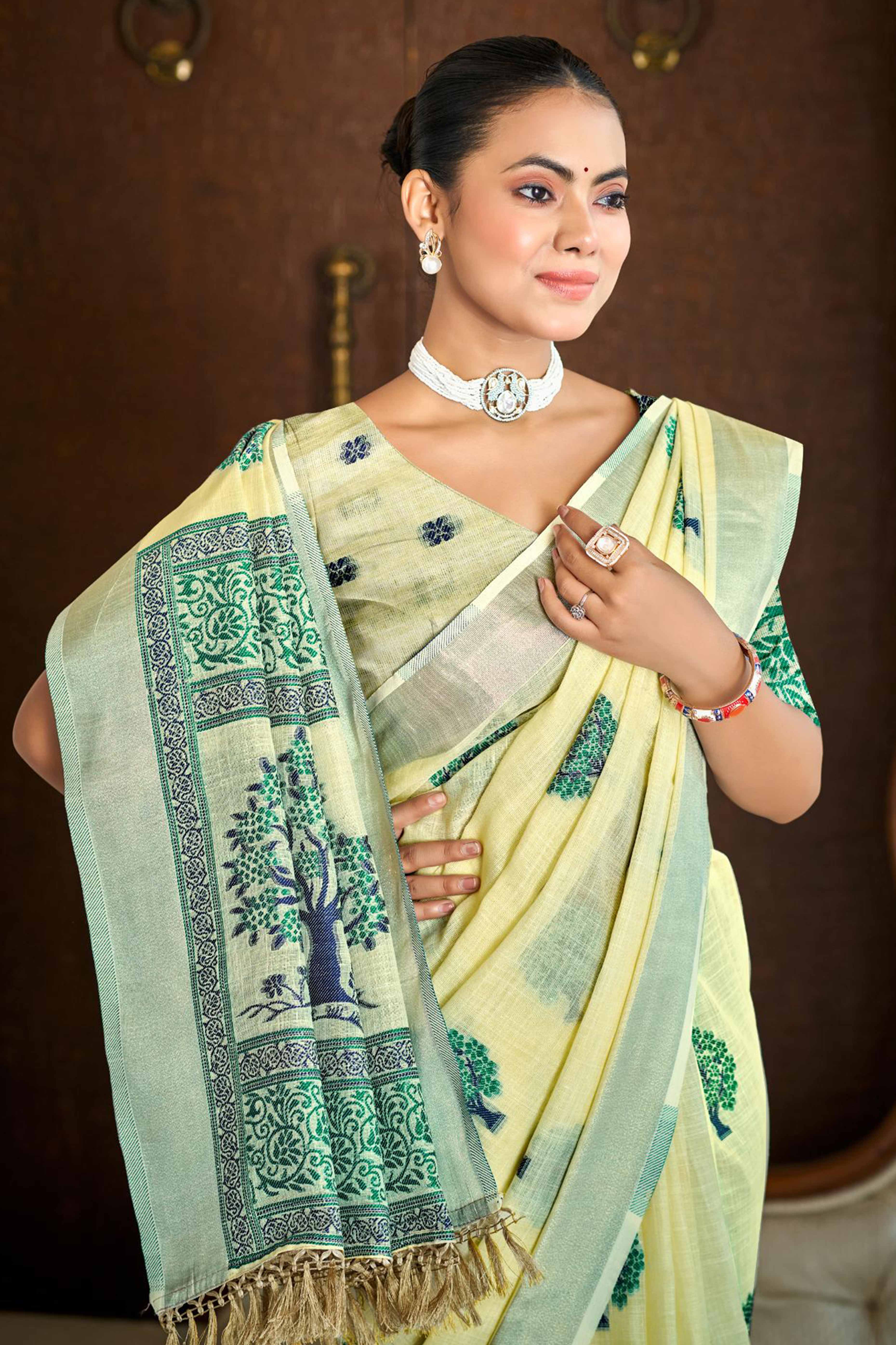 Yellow Linen Saree Adorned With Intricate Zari Weaving & Tassel Pallu