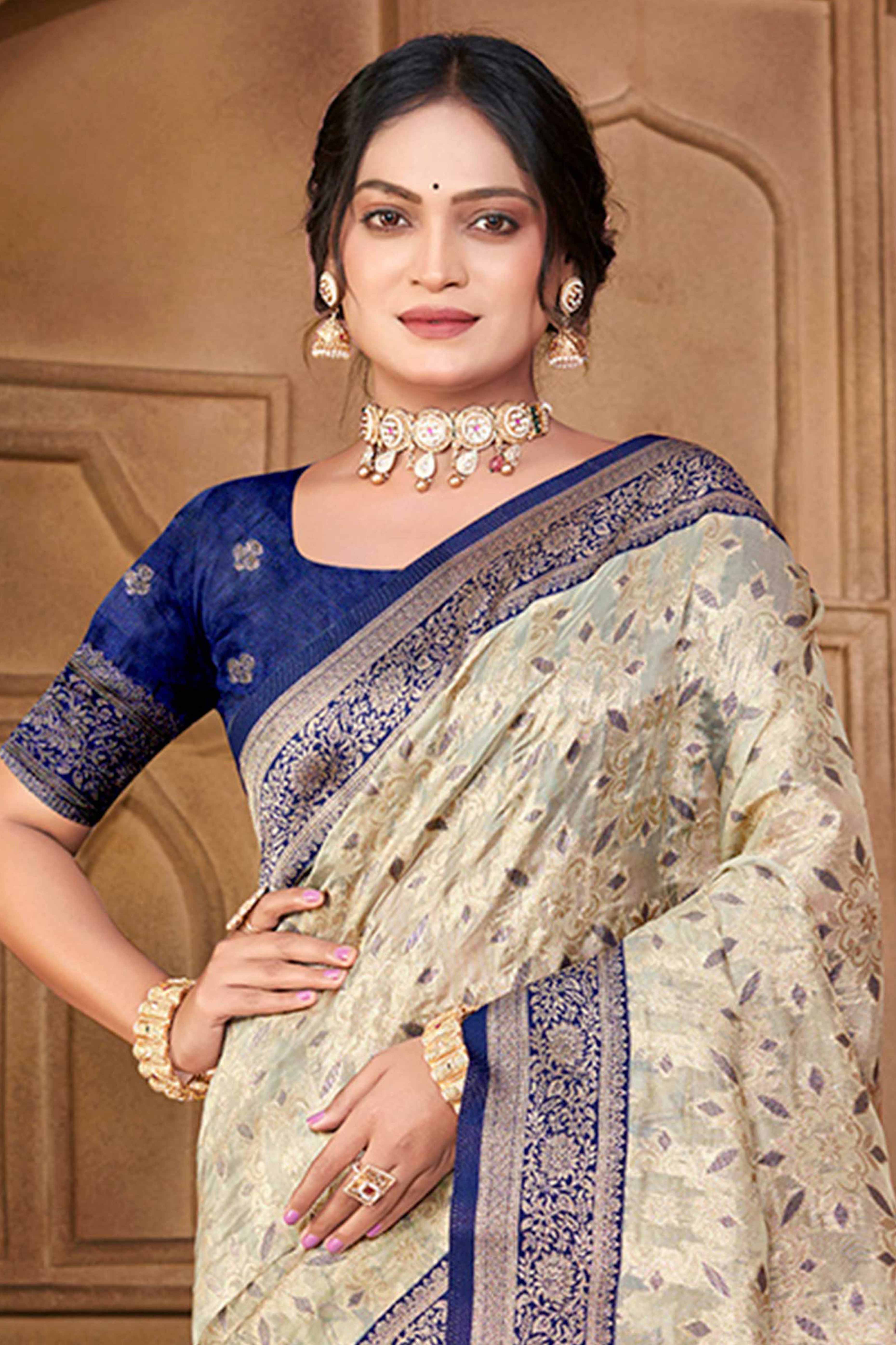 Stunning Beige & Navy Blue Floral Weaving Silk Blend Saree Enhanced With A Stylish Tassel Pallu
