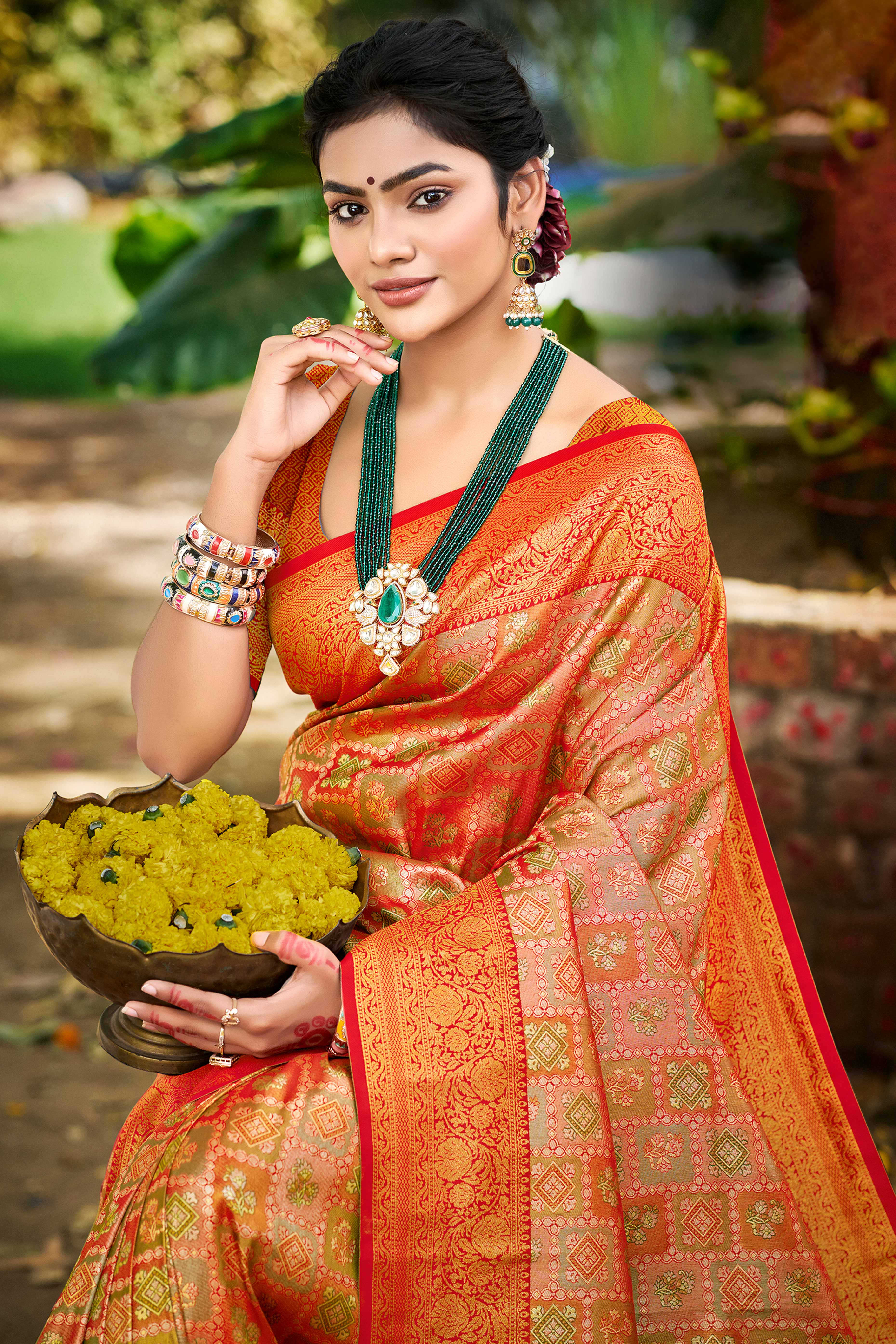 Orange Silk Blend Dharmavaram Saree Featuring Ornate Floral Weaves & Tassels Pallu