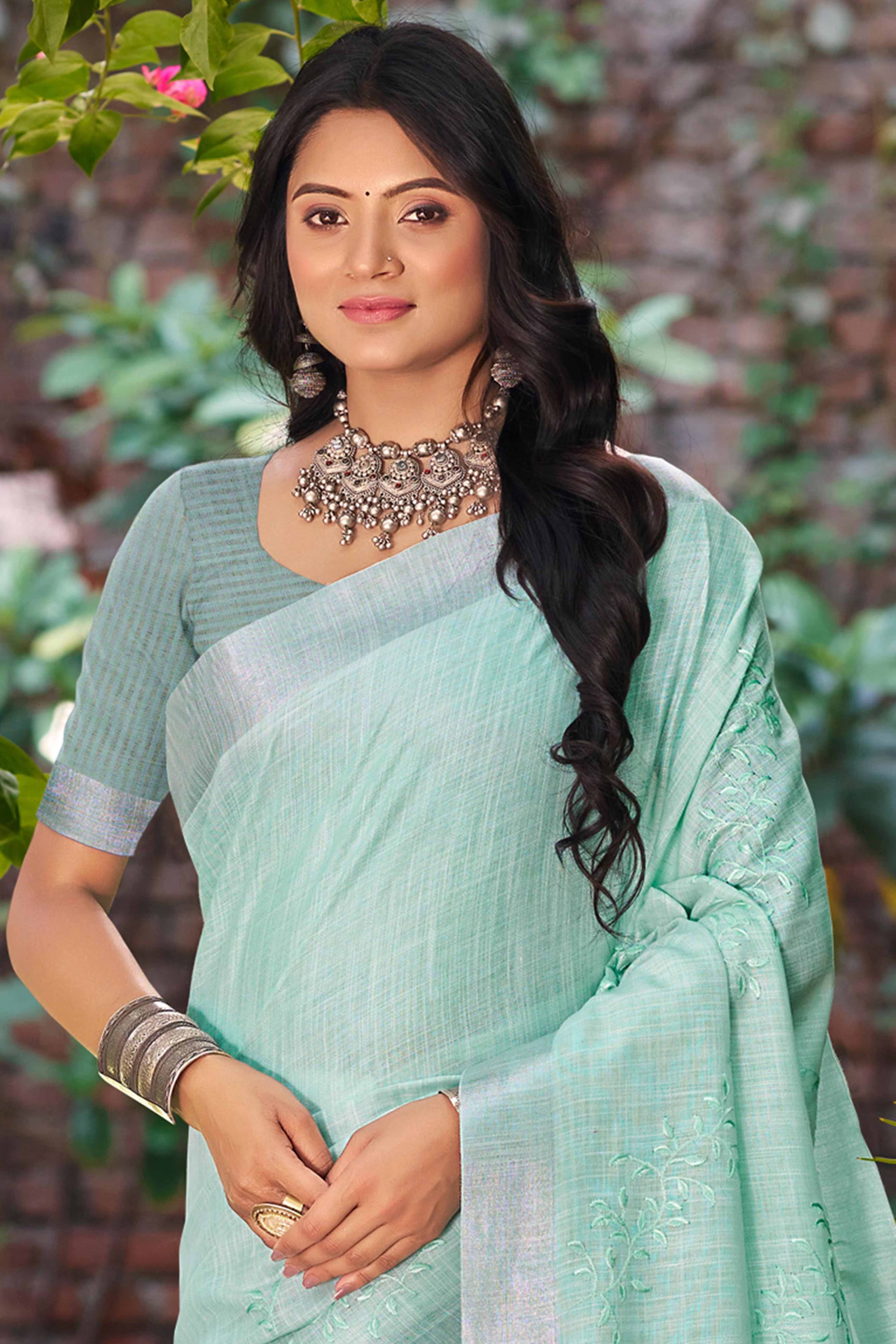 Elegant Sea Green Linen Saree Featuring Intricate Woven & Embroidered Patterns