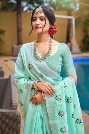 Captivating Turquoise Floral Thread Embroidered Linen Saree With Elegant Weaving Border