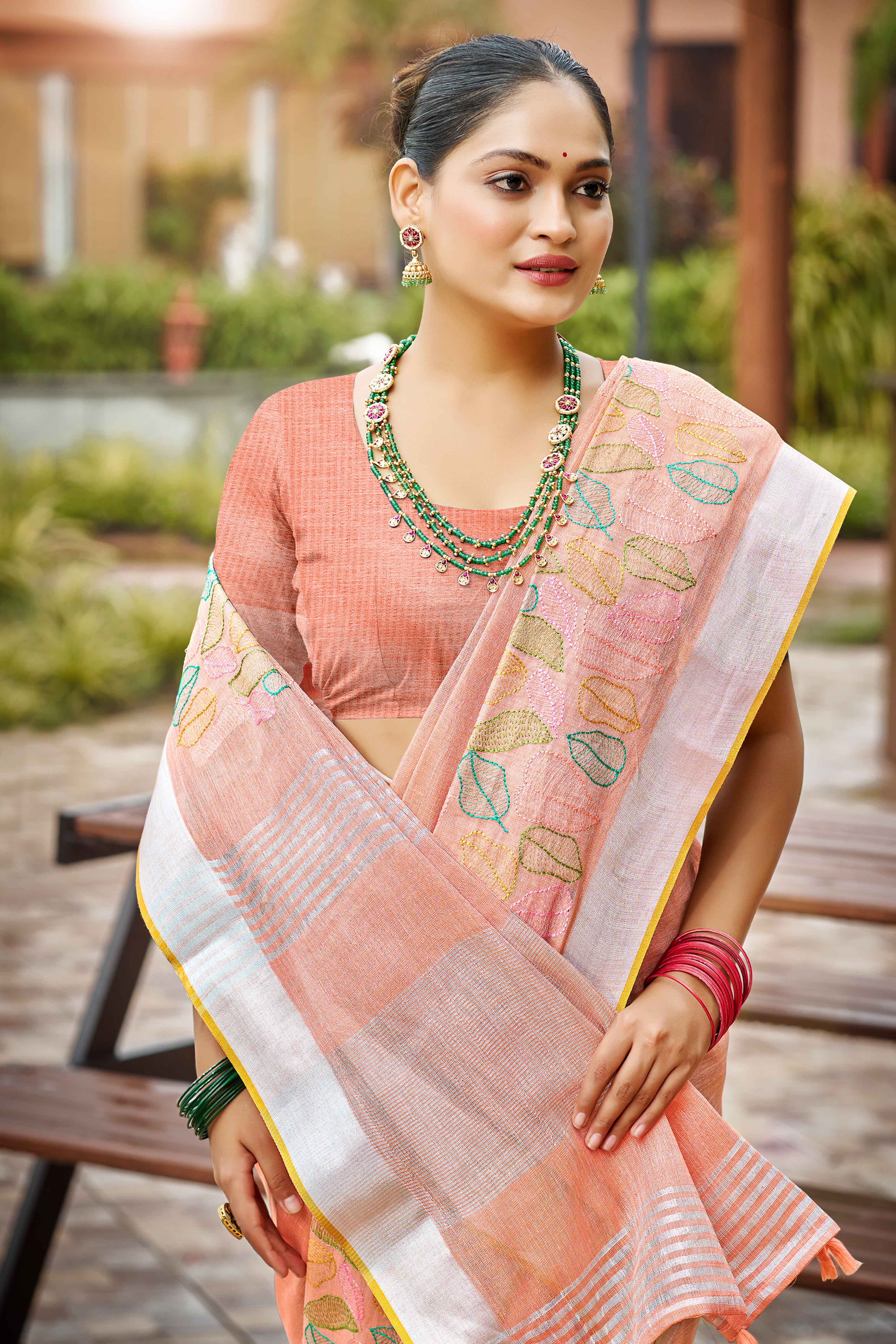 Classic Peach Leaf Pattern Thread Embroidery Work Linen Saree With Tassel Pallu