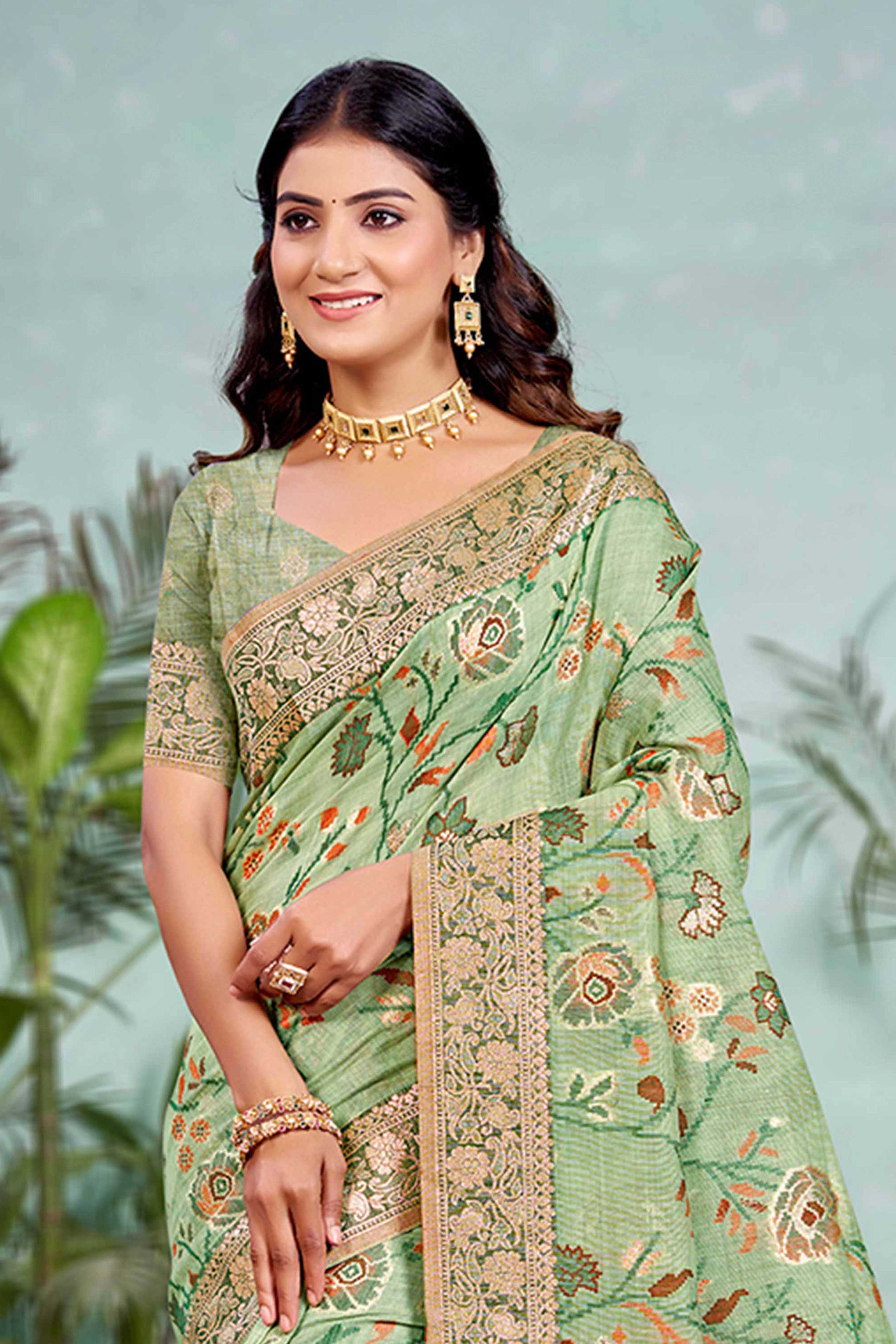 Captivating Green Floral Zari Weaving Cotton Silk Saree Accented With Tassel Pallu