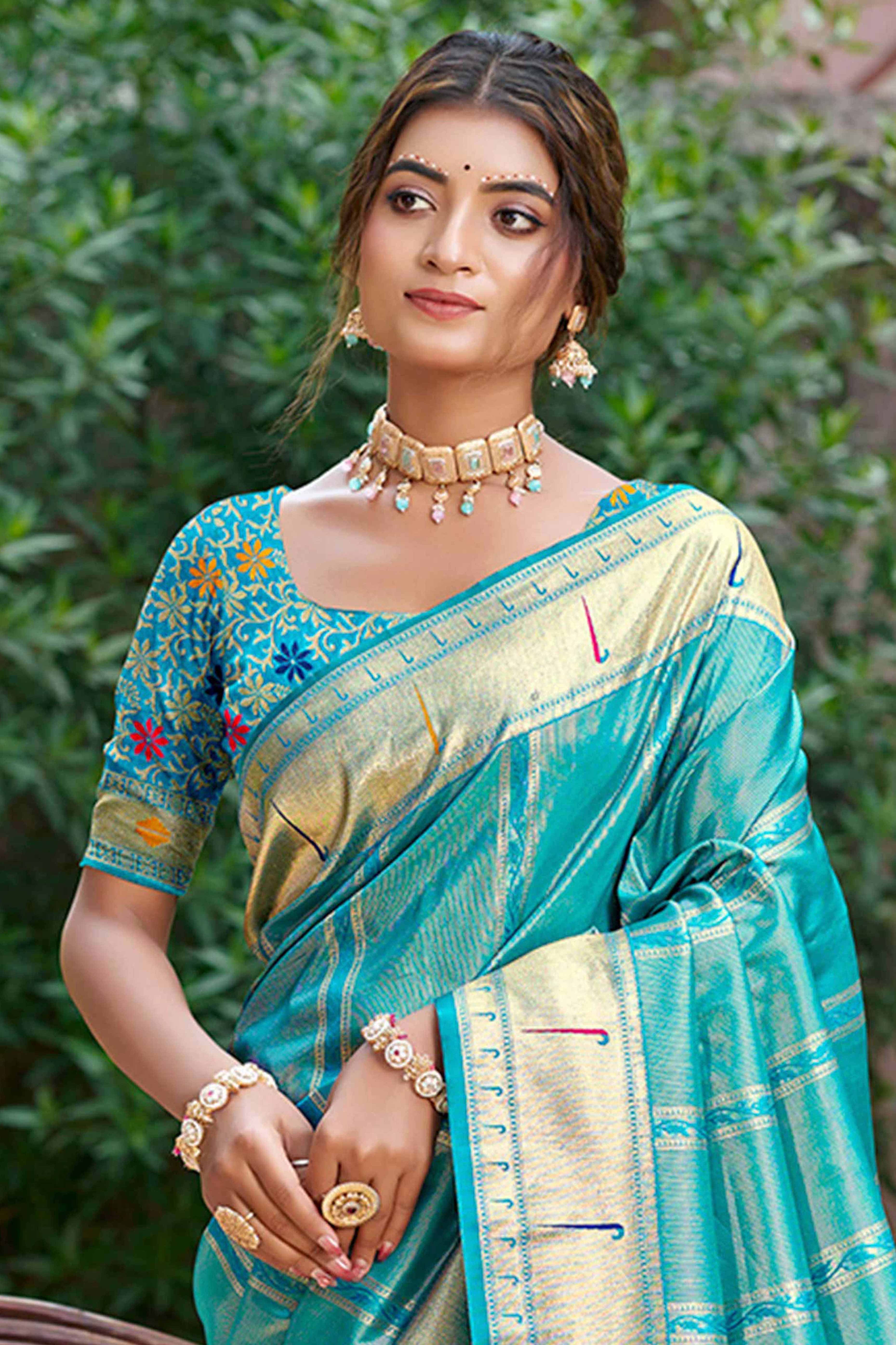 Turquoise Blue Designer Weaving Silk Blend Saree Accented With Graceful Peacock & Floral Motif Pallu
