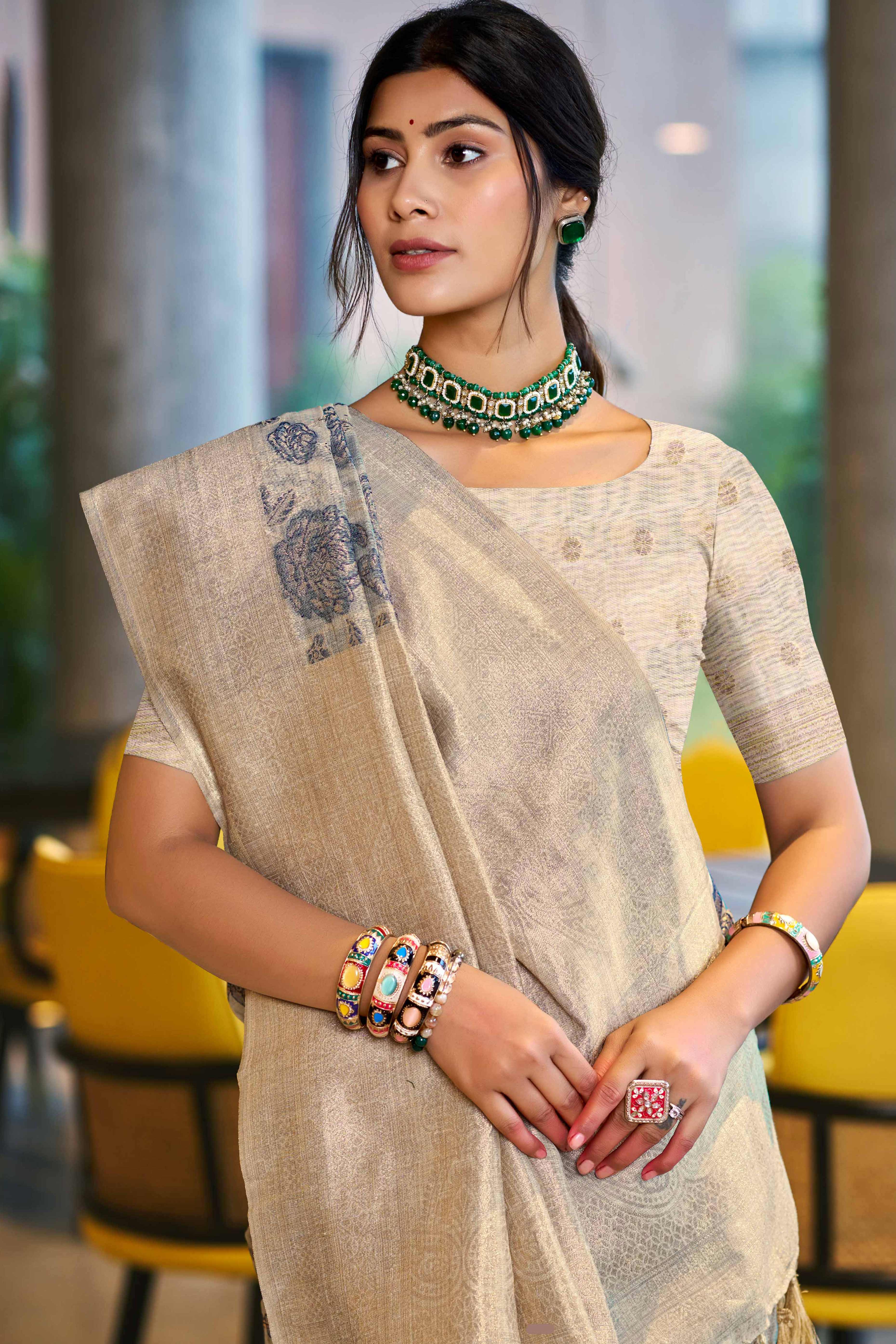 Grey Premium Cotton Silk Saree Highlighted With Floral Weaving Work & Tassel Pallu