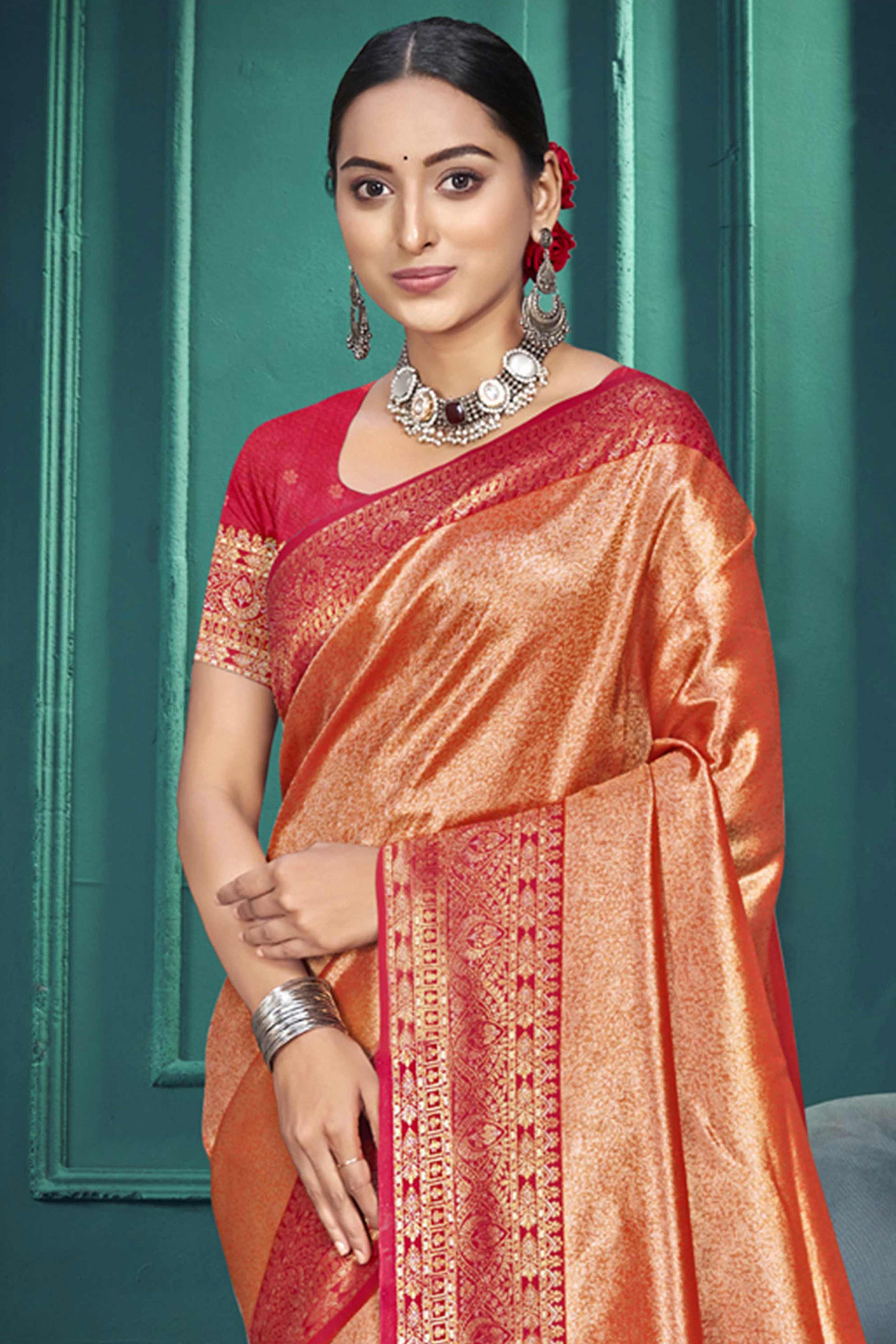 Exclusive Peach Floral Motif Woven Kanjivaram Silk Saree With Graceful Tassel Pallu