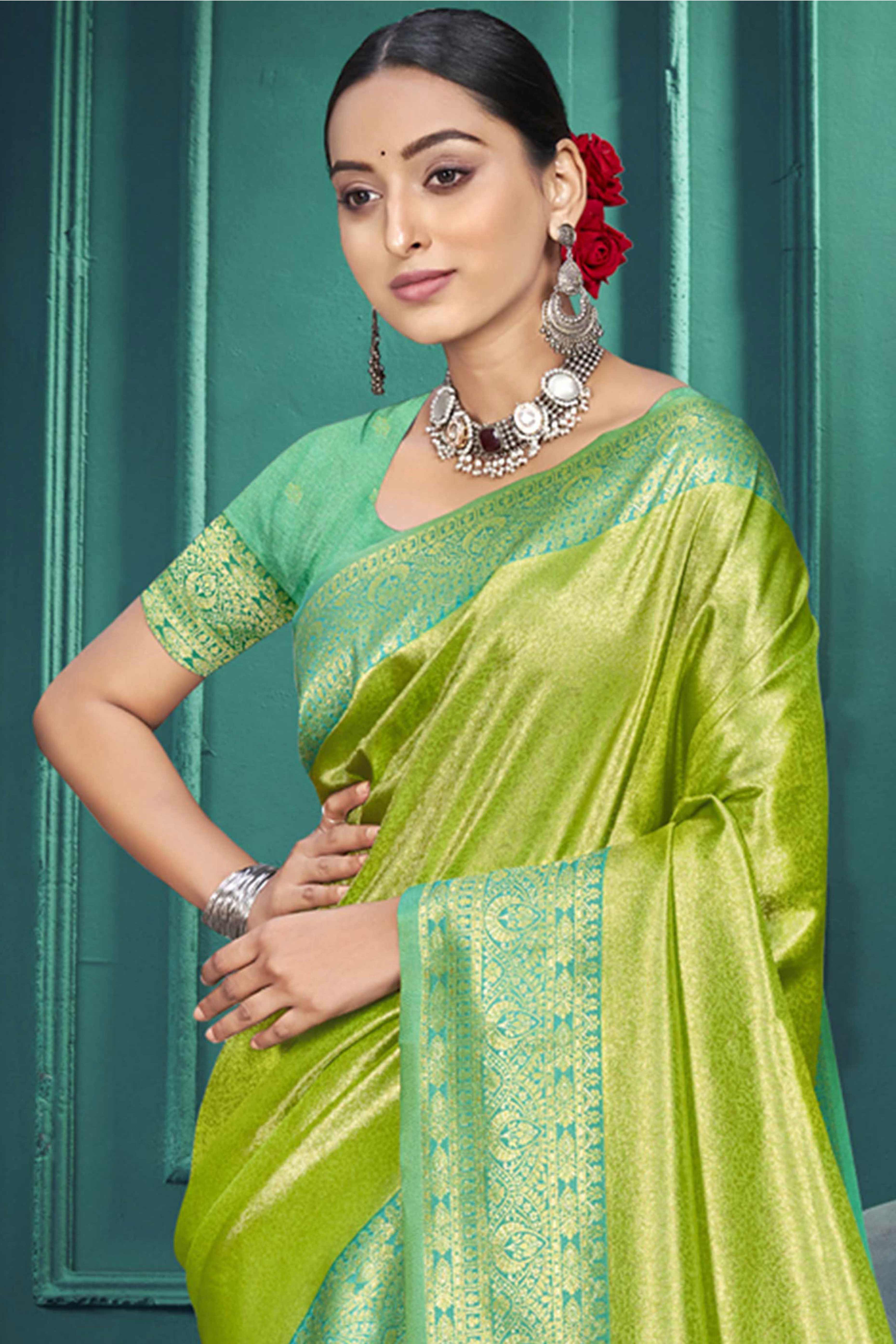 Exclusive Parrot Green Floral Motif Woven Kanjivaram Silk Saree With Graceful Tassel Pallu