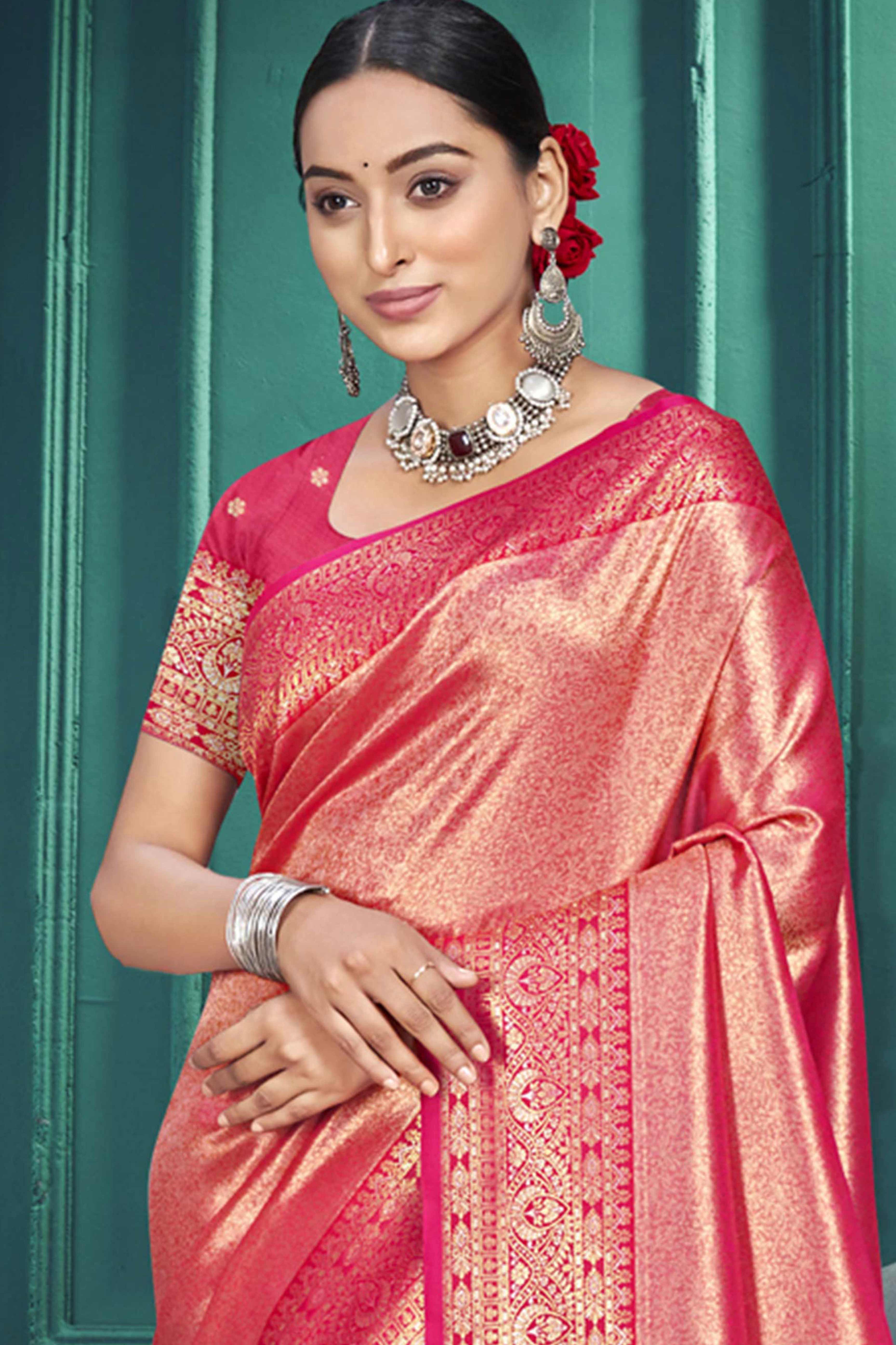 Exclusive Rani Pink Floral Motif Woven Kanjivaram Silk Saree With Graceful Tassel Pallu