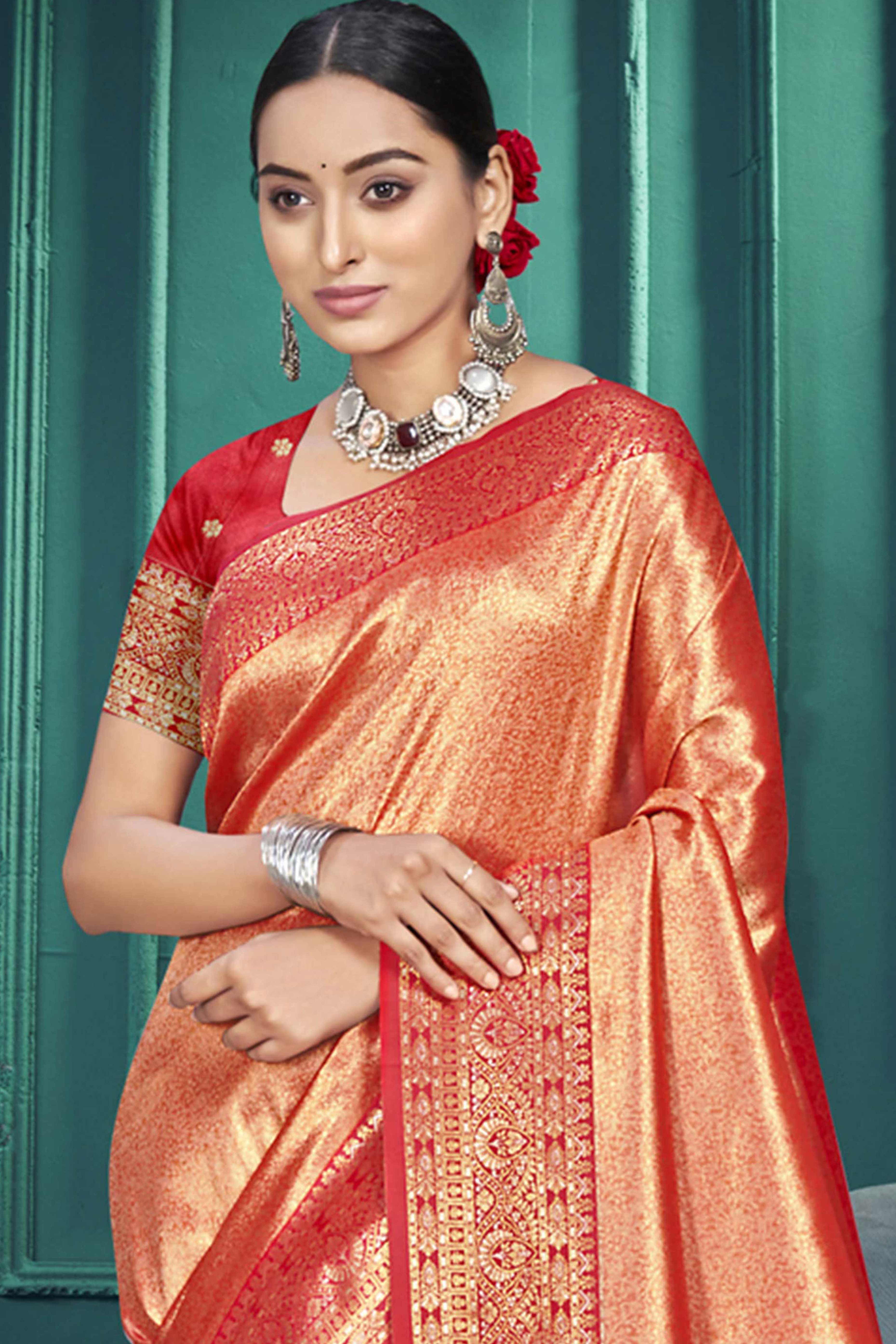 Exclusive Orange Floral Motif Woven Kanjivaram Silk Saree With Graceful Tassel Pallu