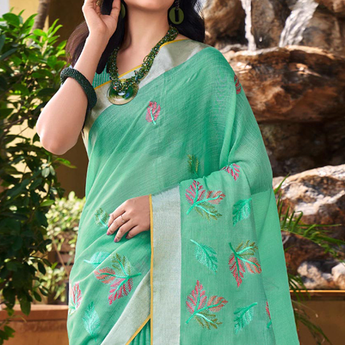 Sea Green Floral Embroidered Linen Saree With Tassels