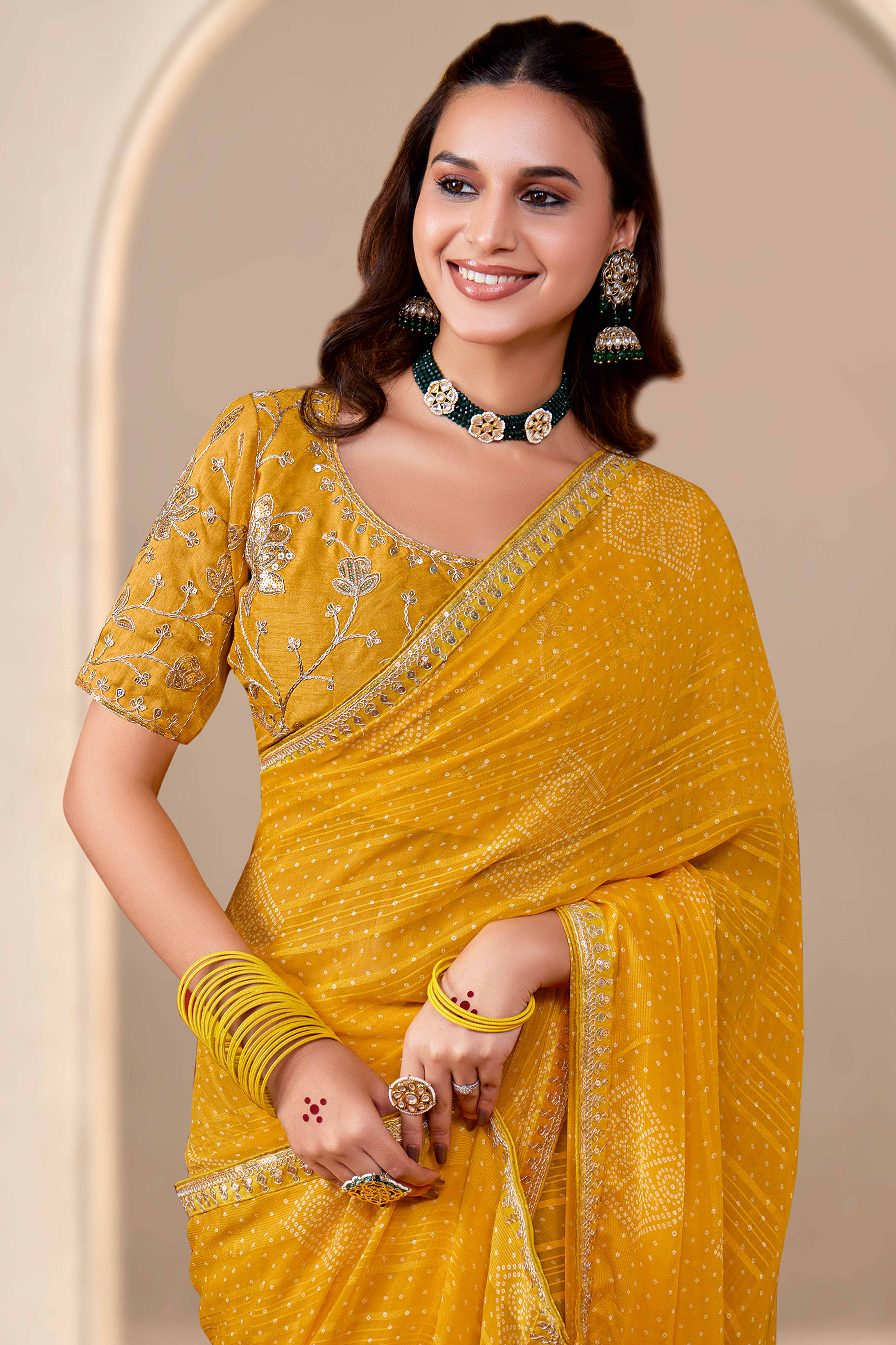 Mustard Bandhani Printed Georgette Saree Enhanced With Sequins & Cording Embroidered Lace Border