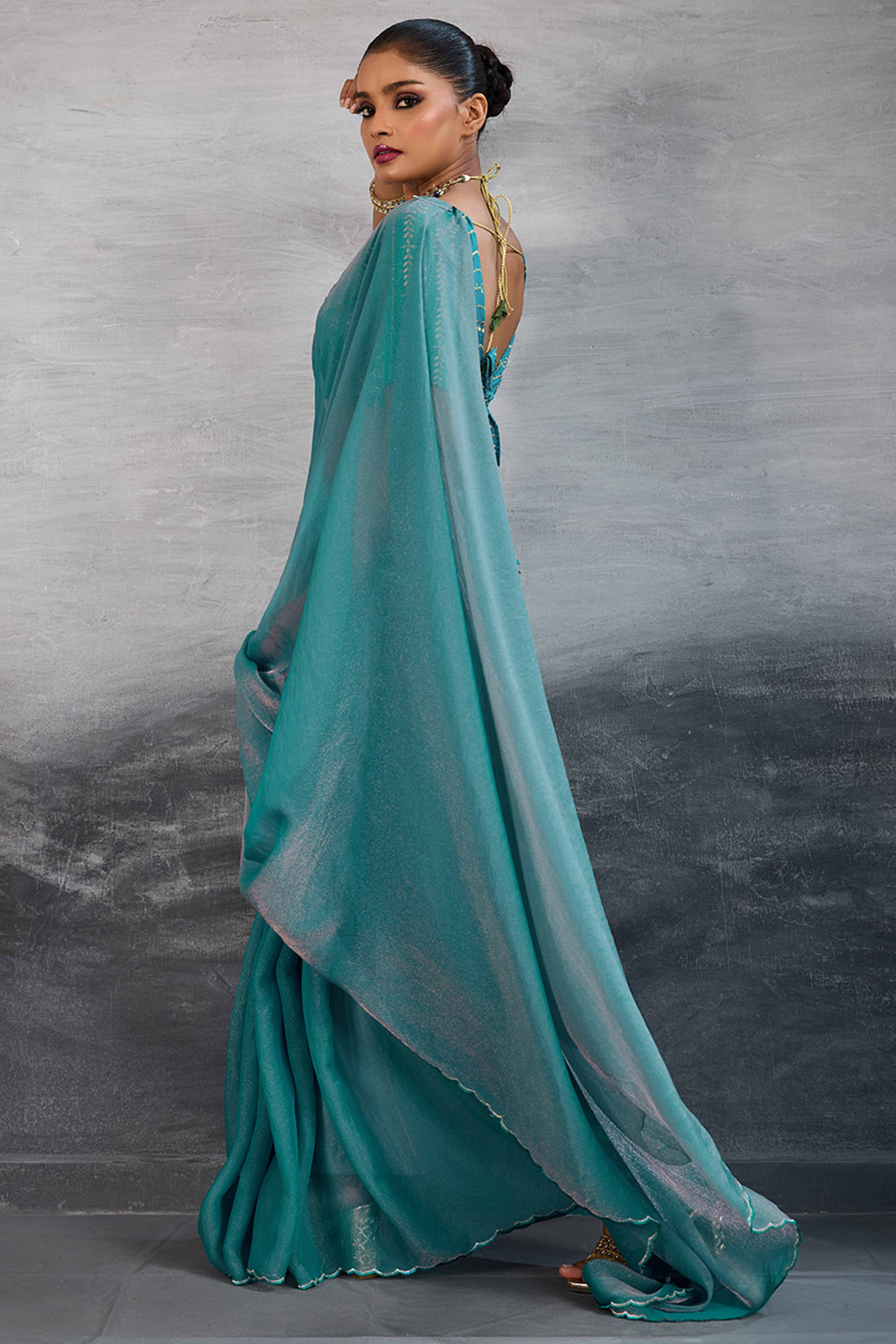 Turquoise Solid Organza Jimmy Choo Saree Accentuated With Elegant Cutwork Border Detailing
