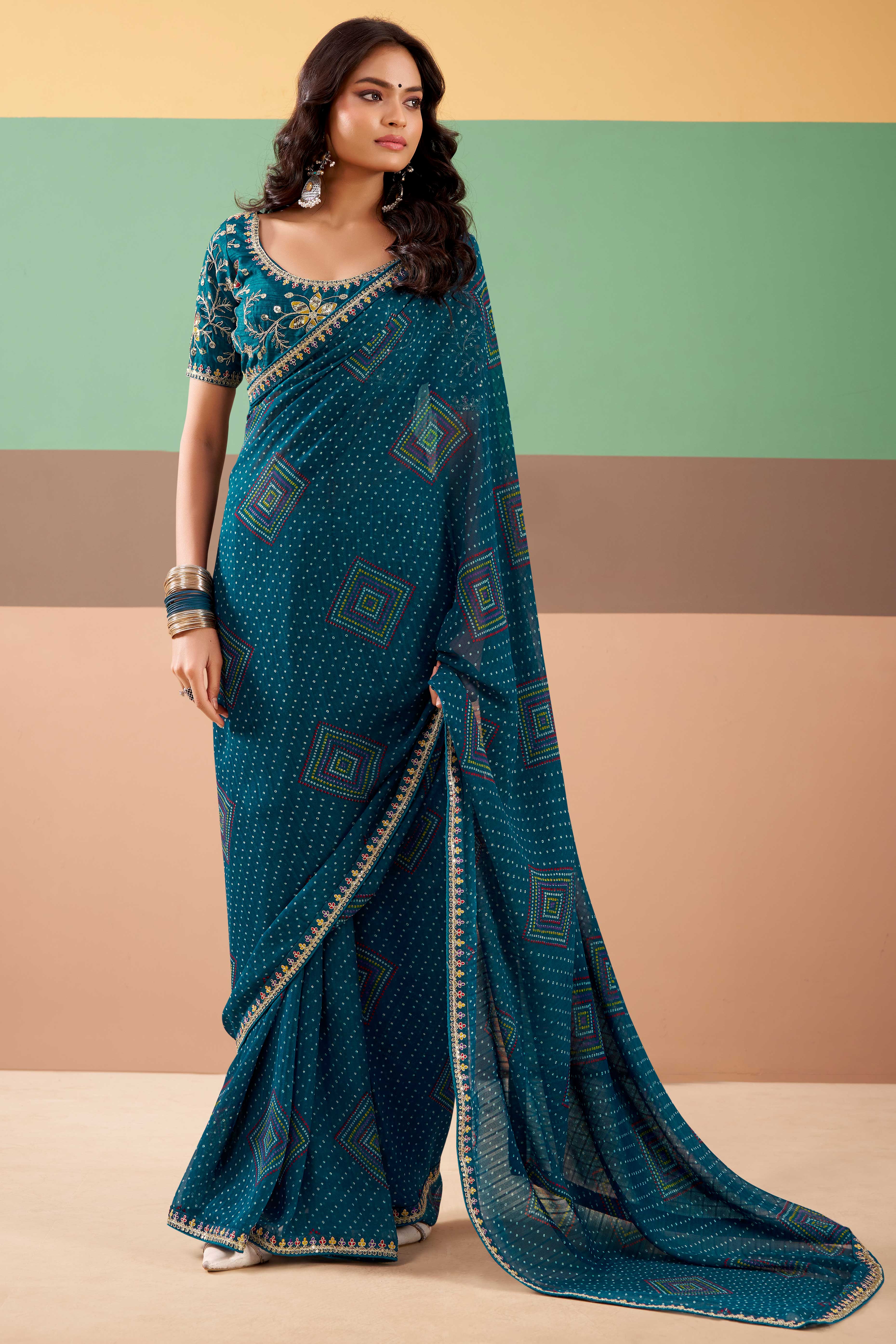 Charming Teal Bandhani Printed Georgette Saree Adorned With Intricate Cording Embroidered Border