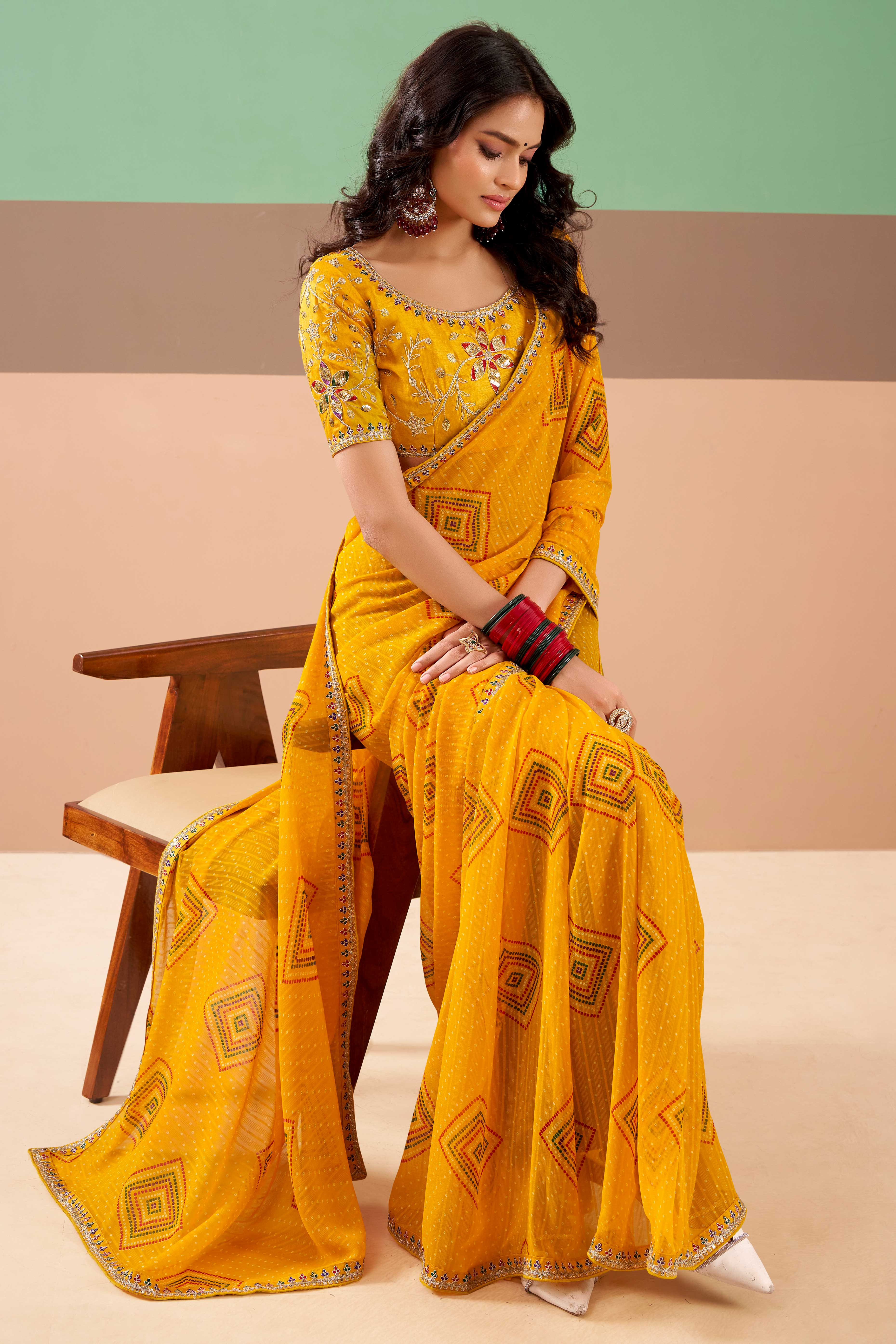 Charming Mustard Bandhani Printed Georgette Saree Adorned With Cording Embroidered Border