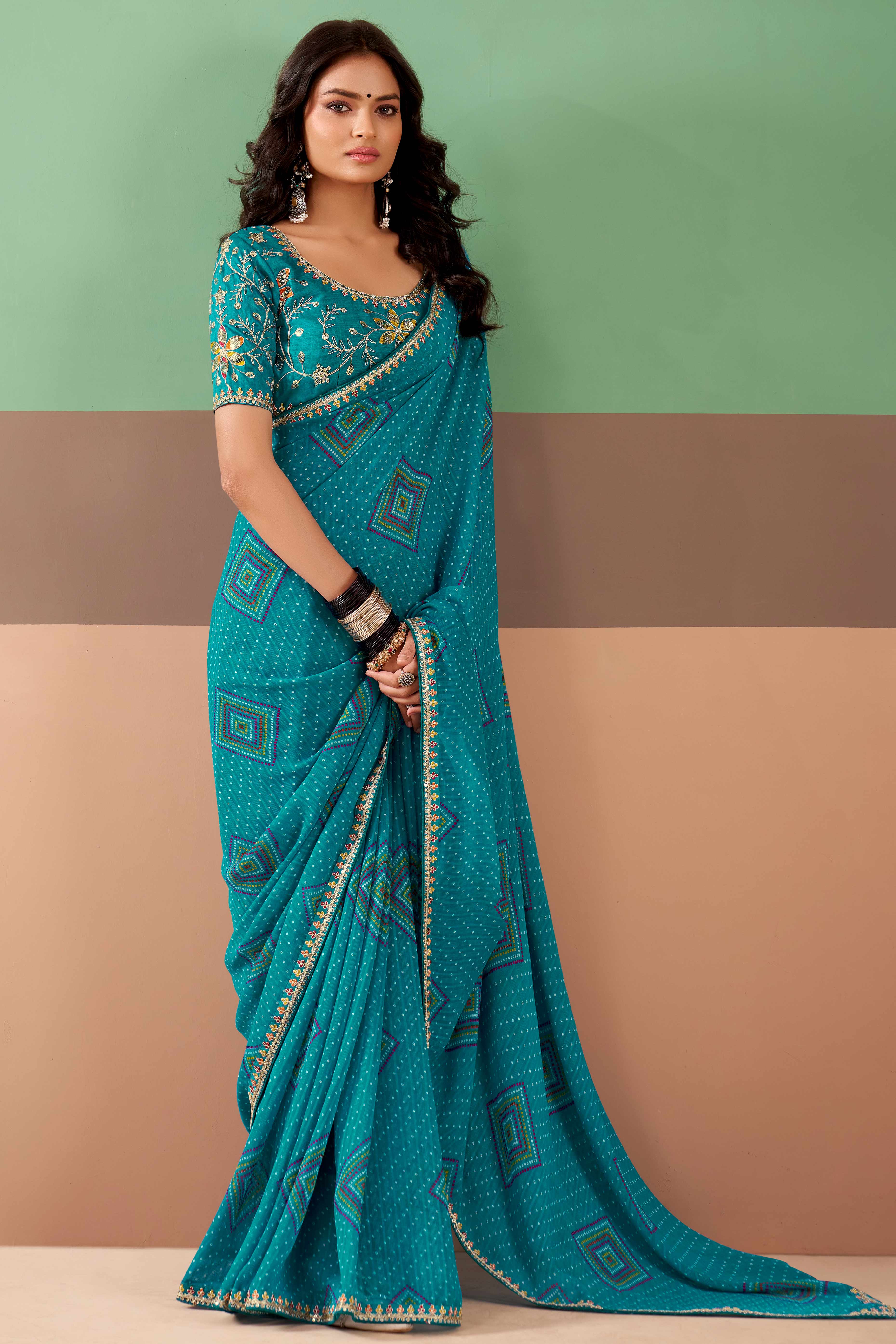 Charming Blue Bandhani Printed Georgette Saree Adorned With Intricate Cording Embroidered Border