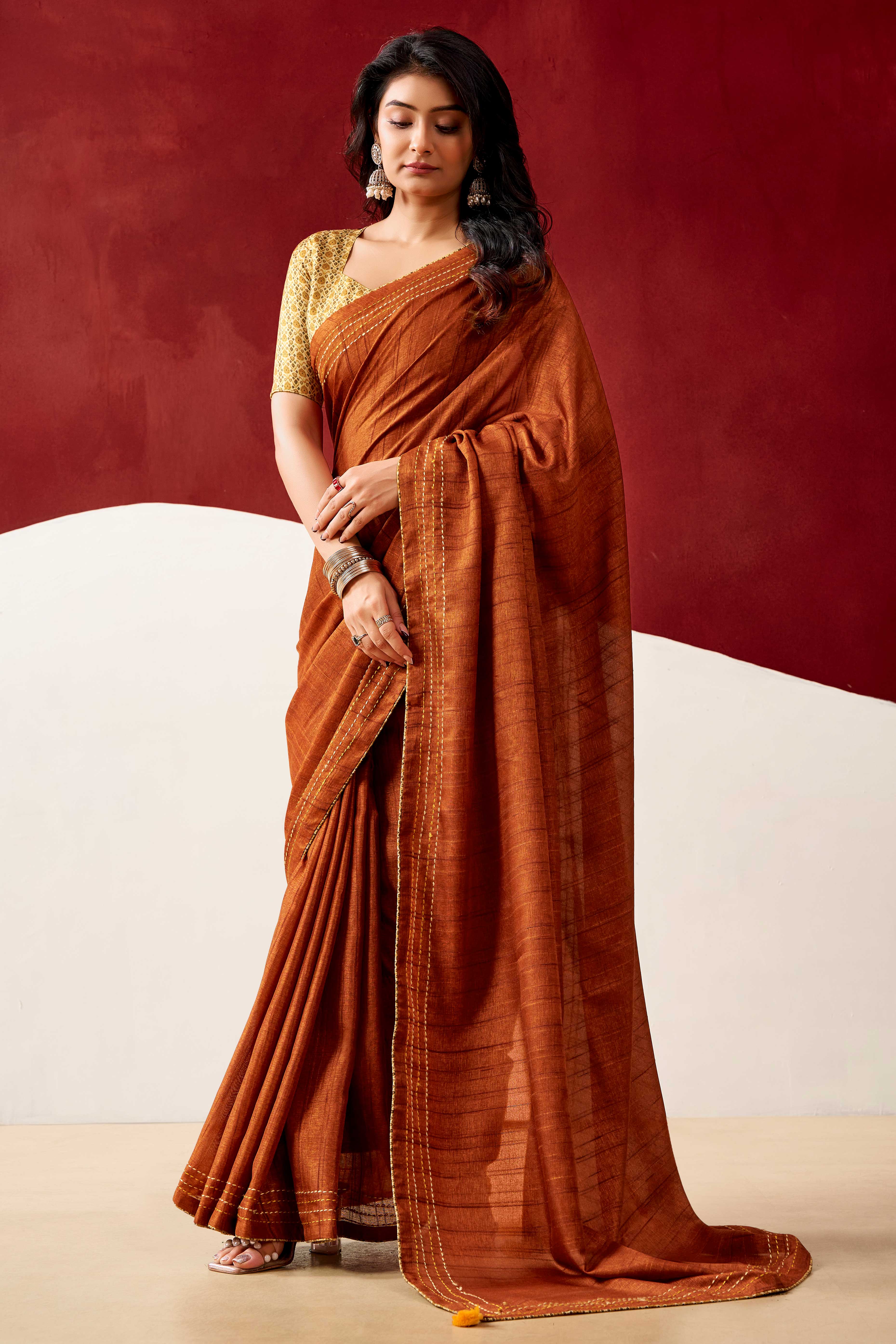 Graceful Rust Handloom Cotton Blend Saree Featuring Striped Lining Embroidery & Tassel Pallu