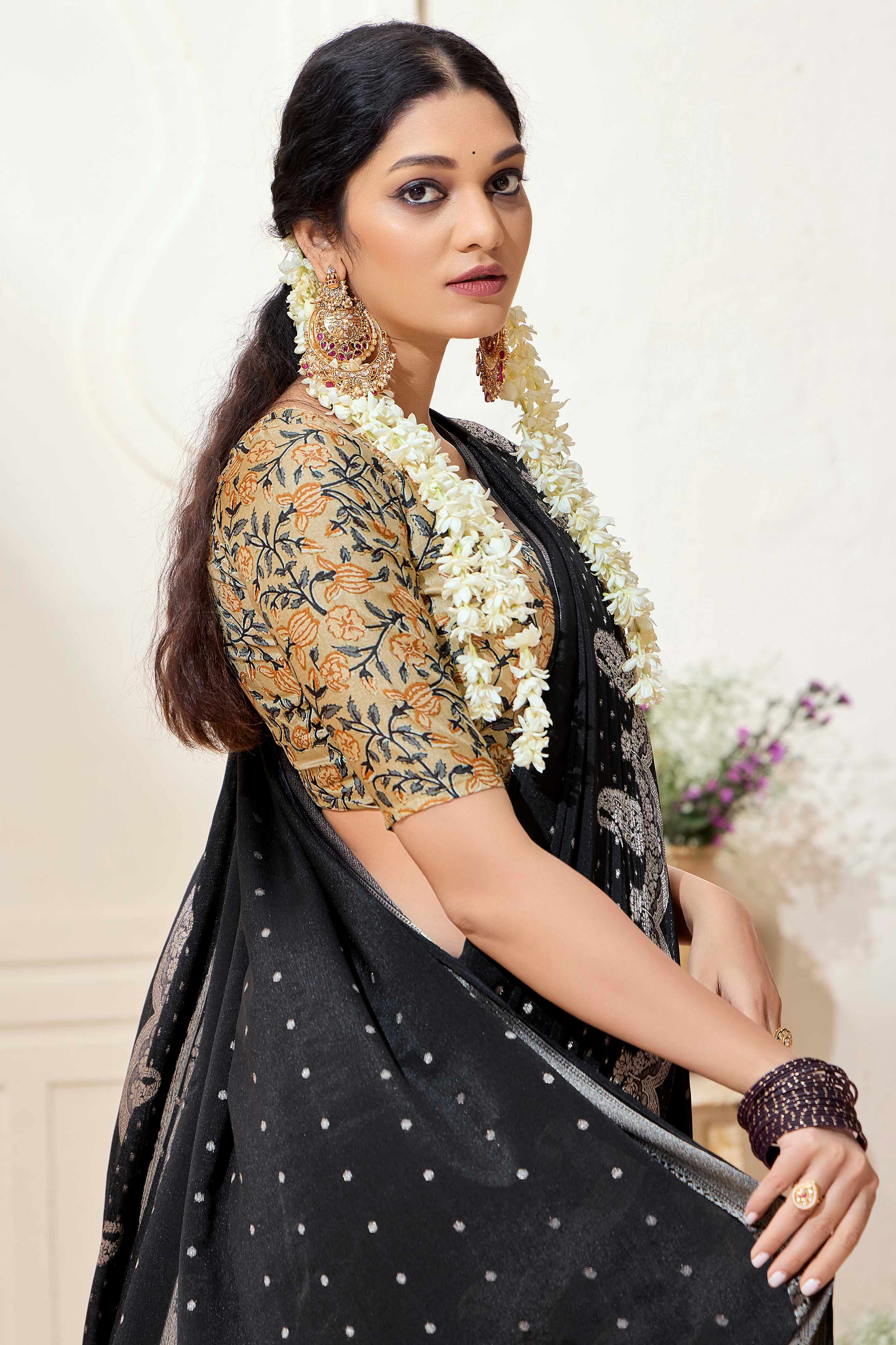 Black Chinon Saree with Jacquard Weaving and Delicate Tassel Accents