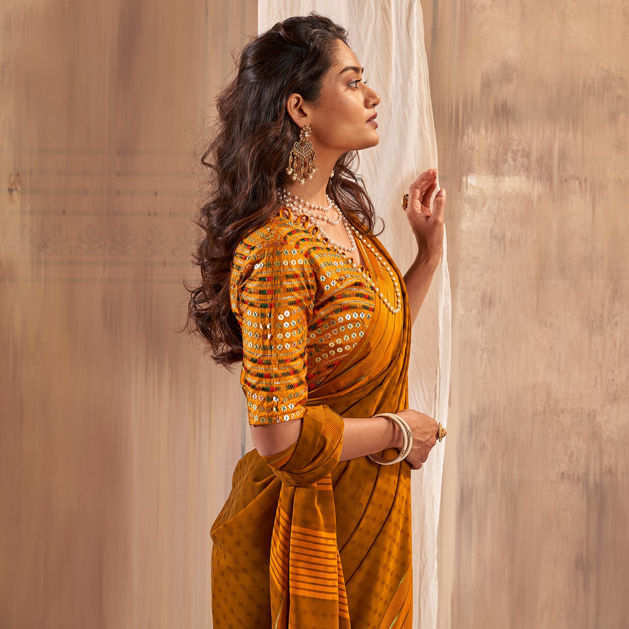 Mustard Woven Georgette Saree With Tassels