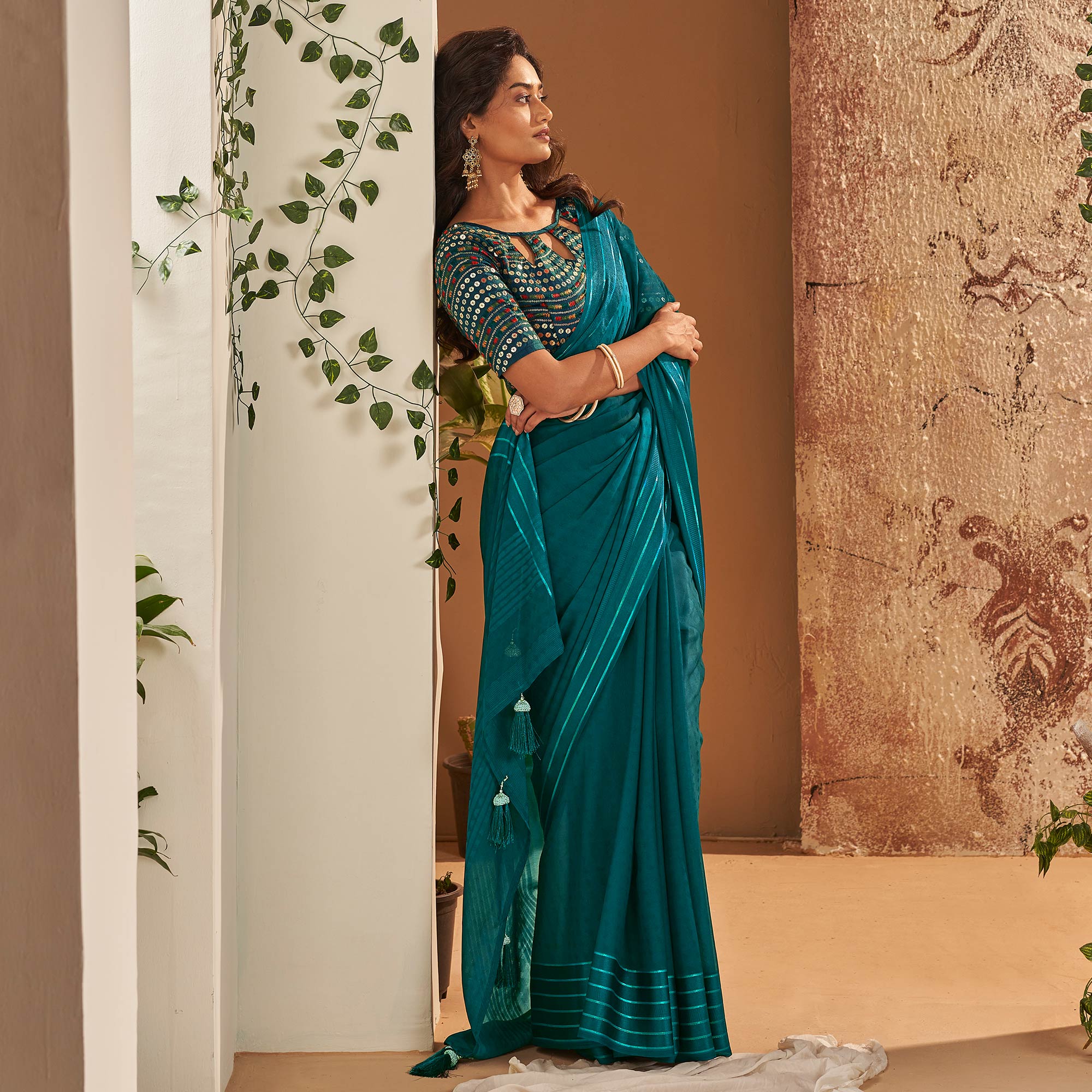 Teal Woven Georgette Saree With Tassels