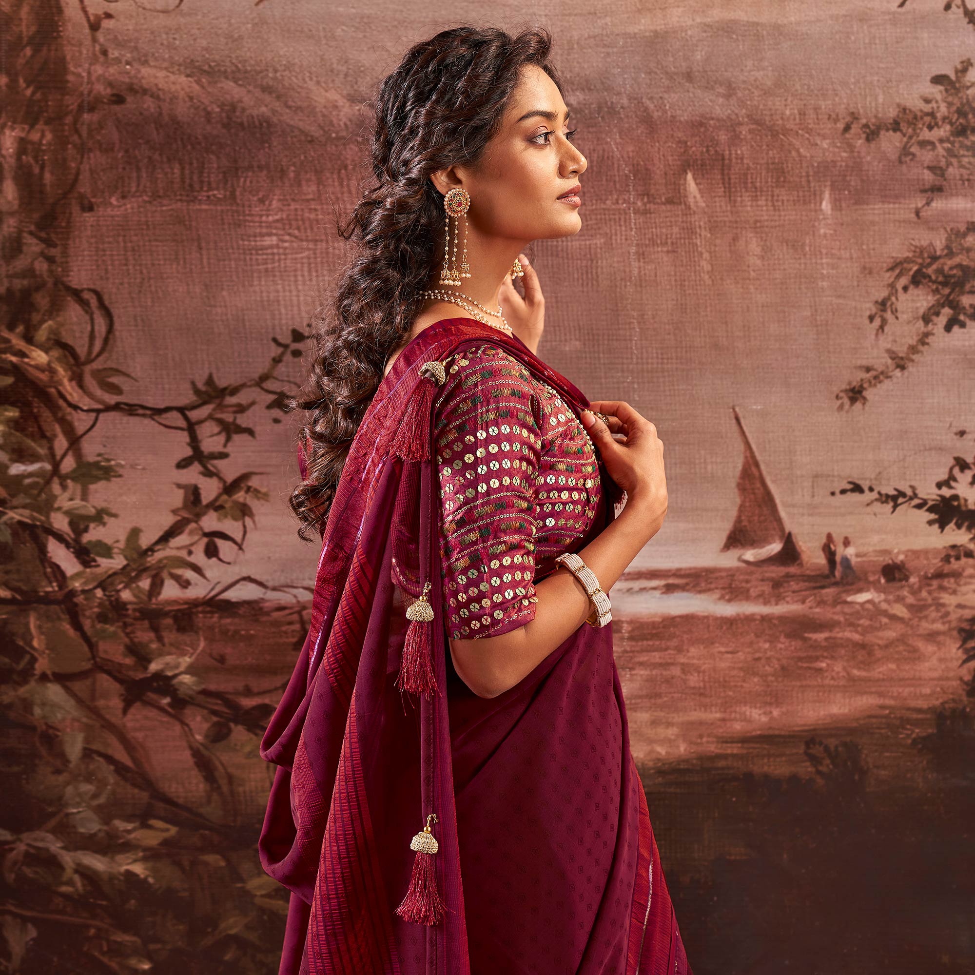 Wine Woven Georgette Saree With Tassels