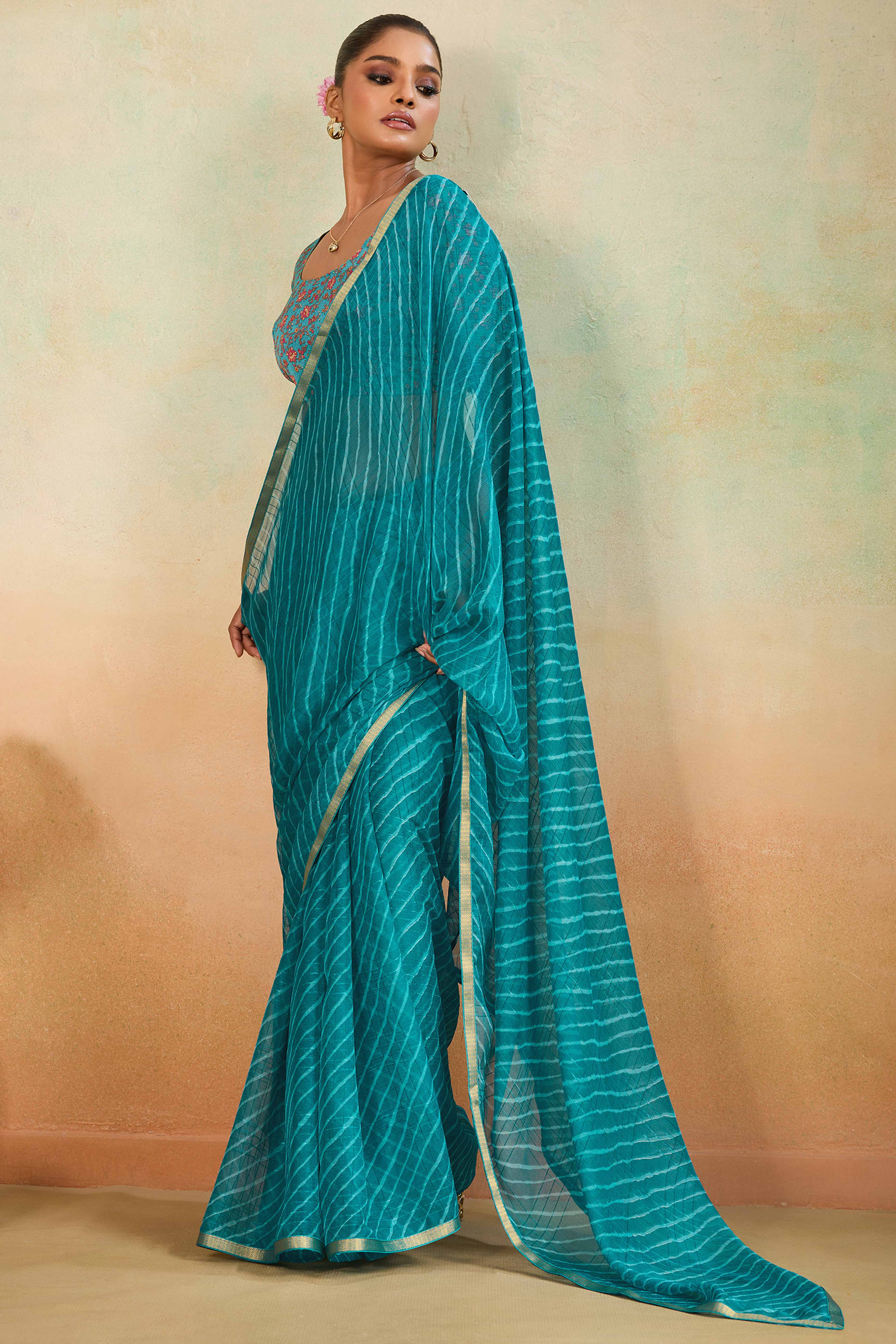 Teal Leheriya Chiffon Saree Accented With Elegant Zari Lace Border Work