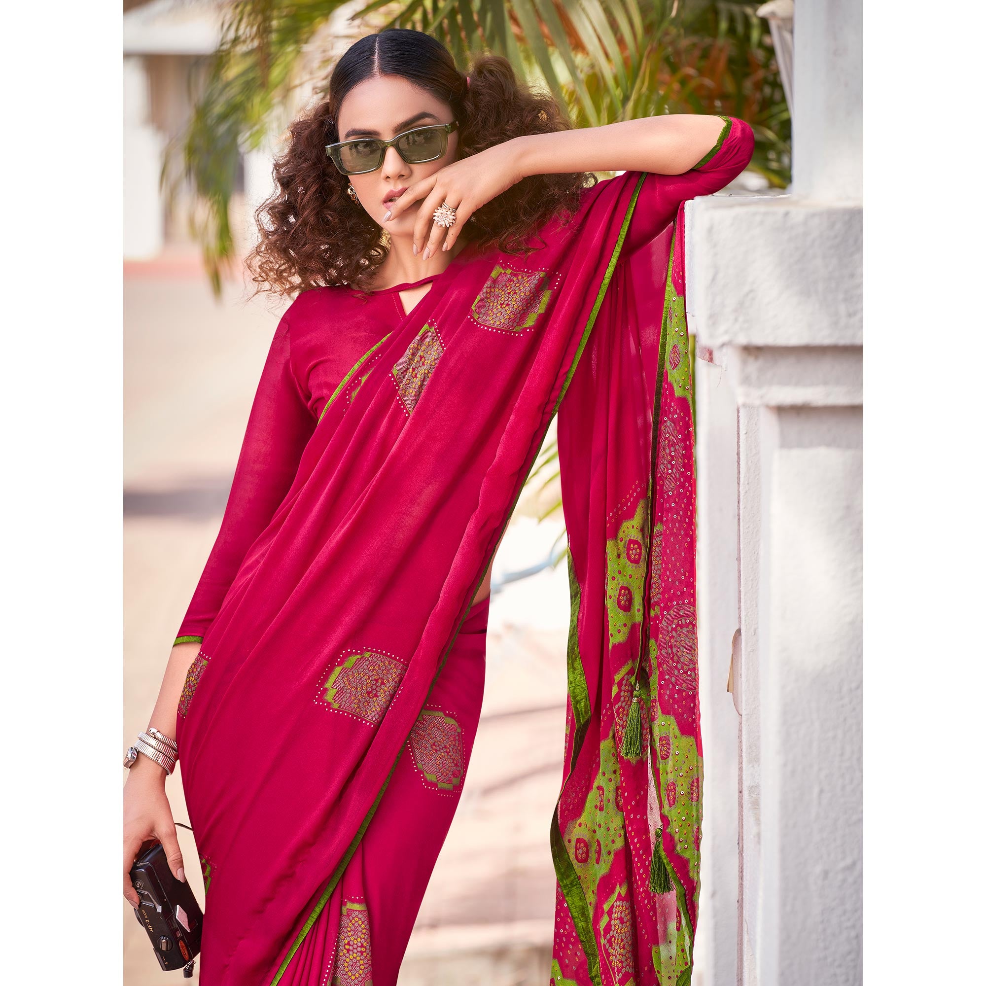 Pink Foil Printed Georgette Saree With Tassels