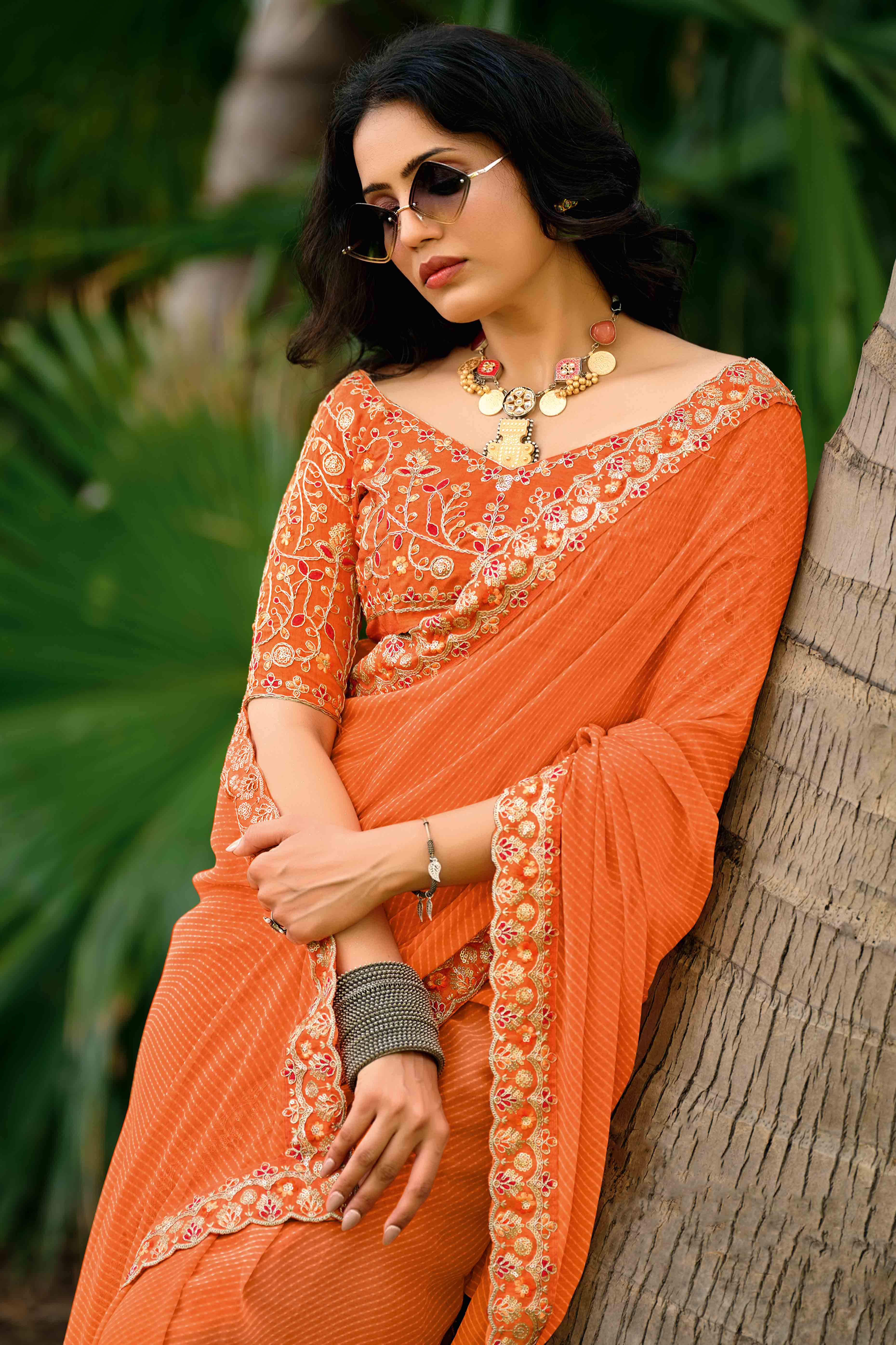 Orange Striped Printed Georgette Saree With Shimmering Sequin Embroidered Border