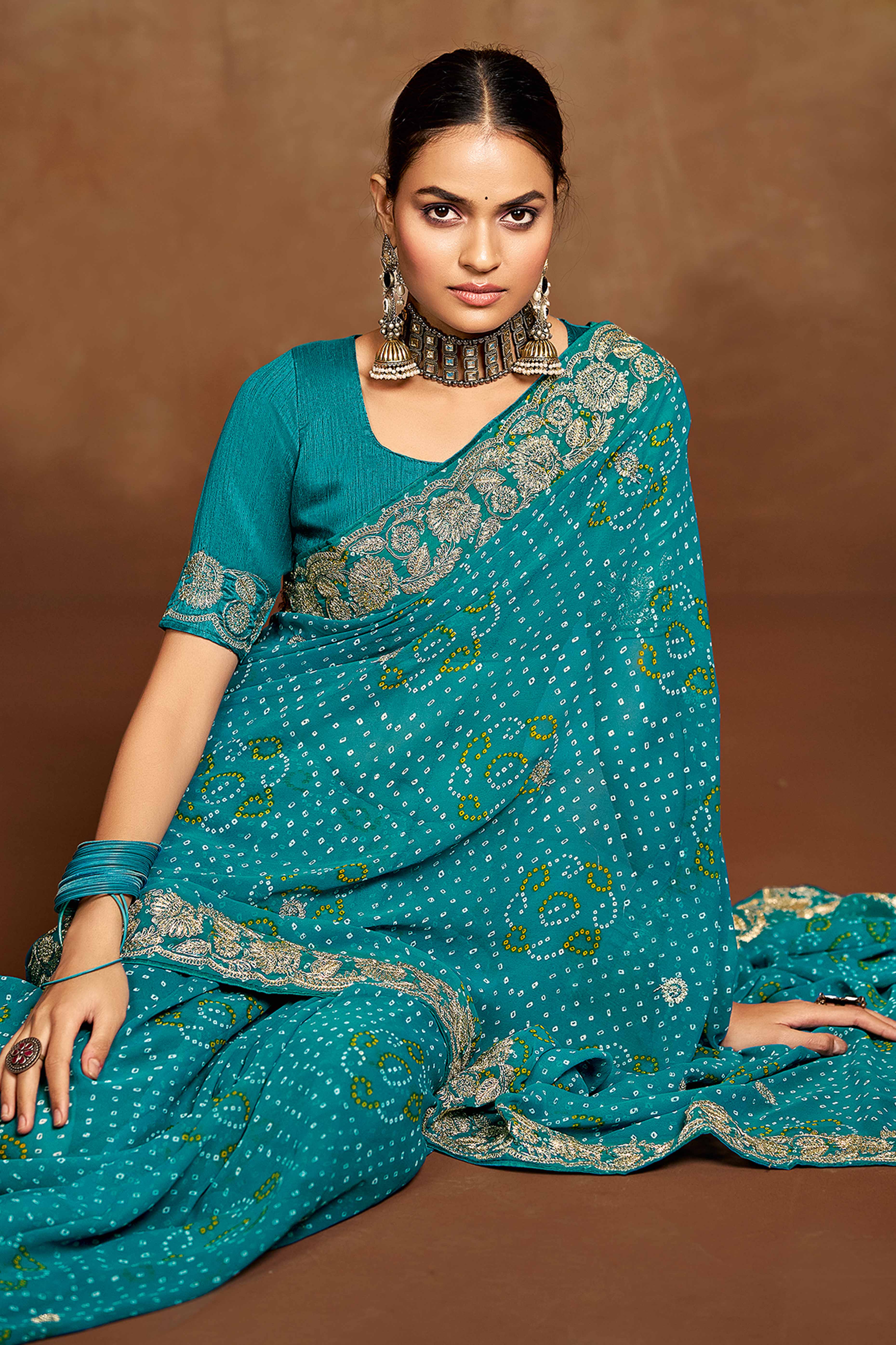 Blue Georgette Saree Adorned With Traditional Bandhani Prints & Intricate Floral Embroidery