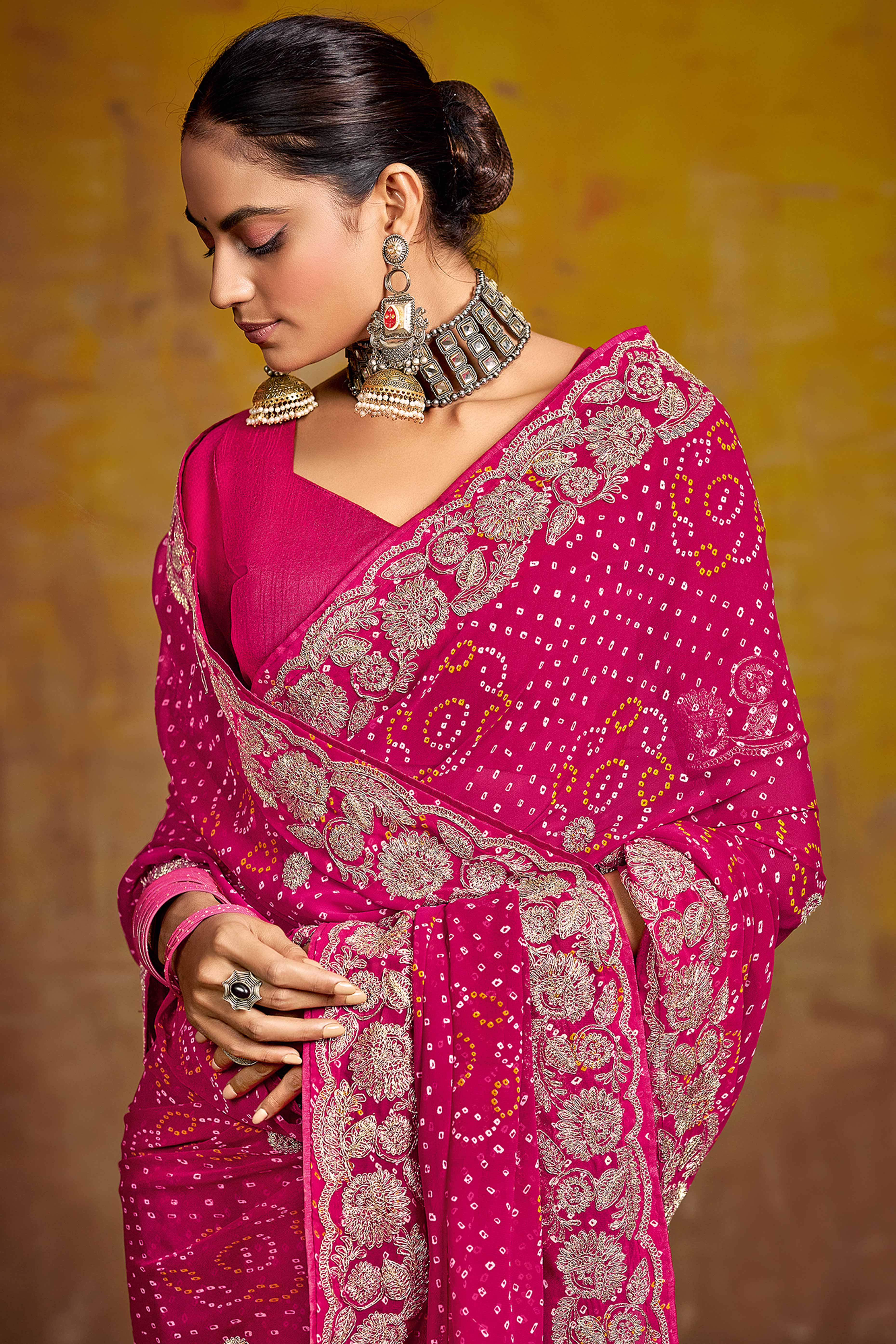 Pink Georgette Saree Adorned With Traditional Bandhani Prints & Intricate Floral Embroidery